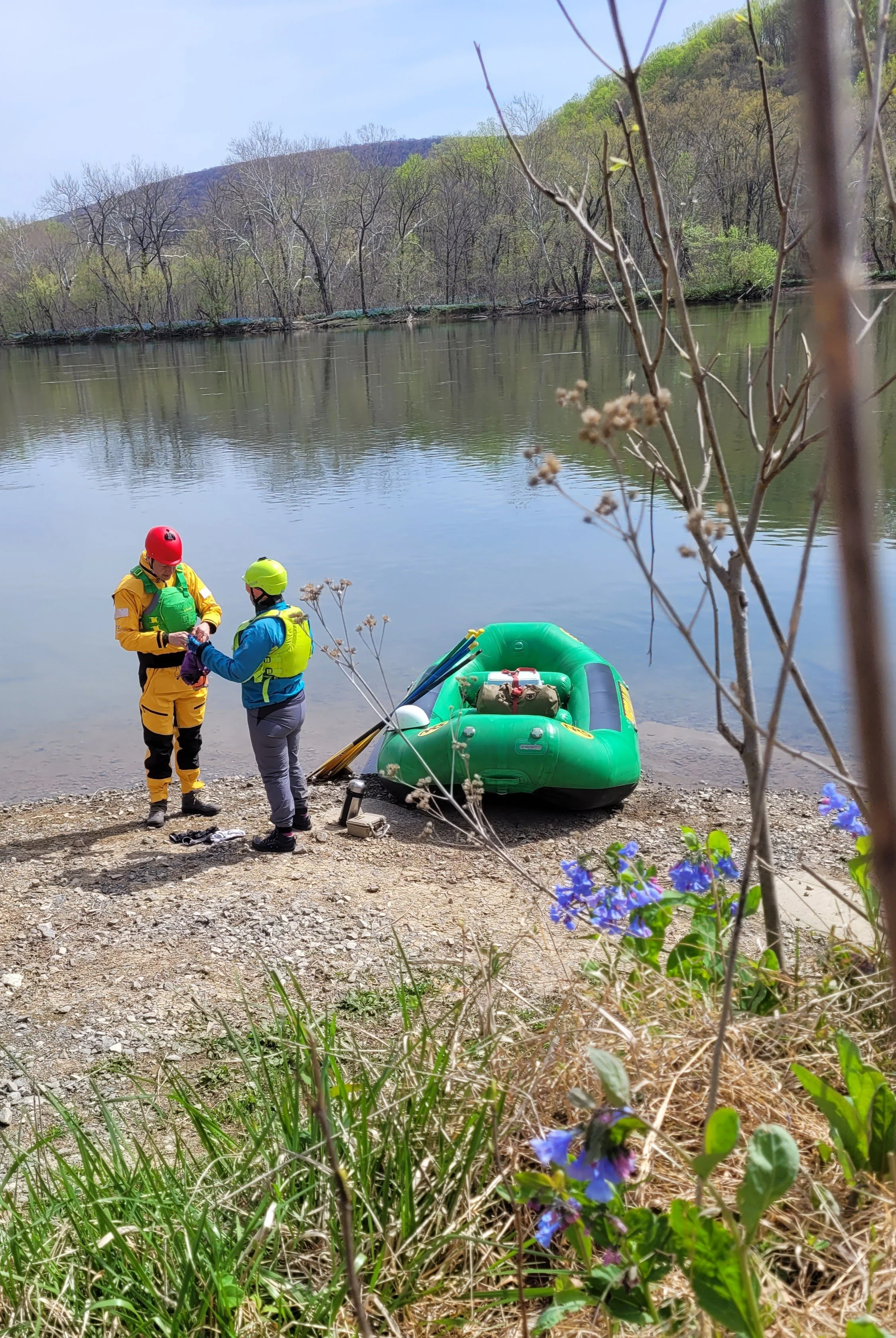 Spring custom private raft course with Virginia Bluebells in the foreground