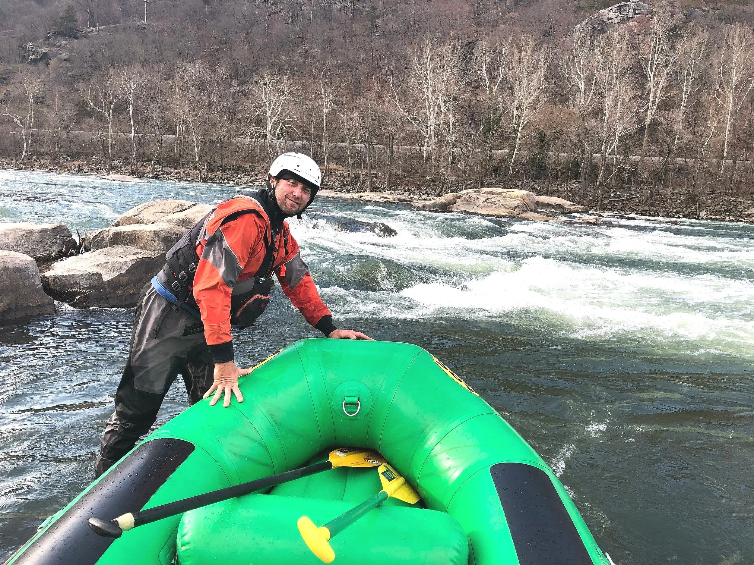 Jeff Cogle stands in front of a rapid called Coglers Hole