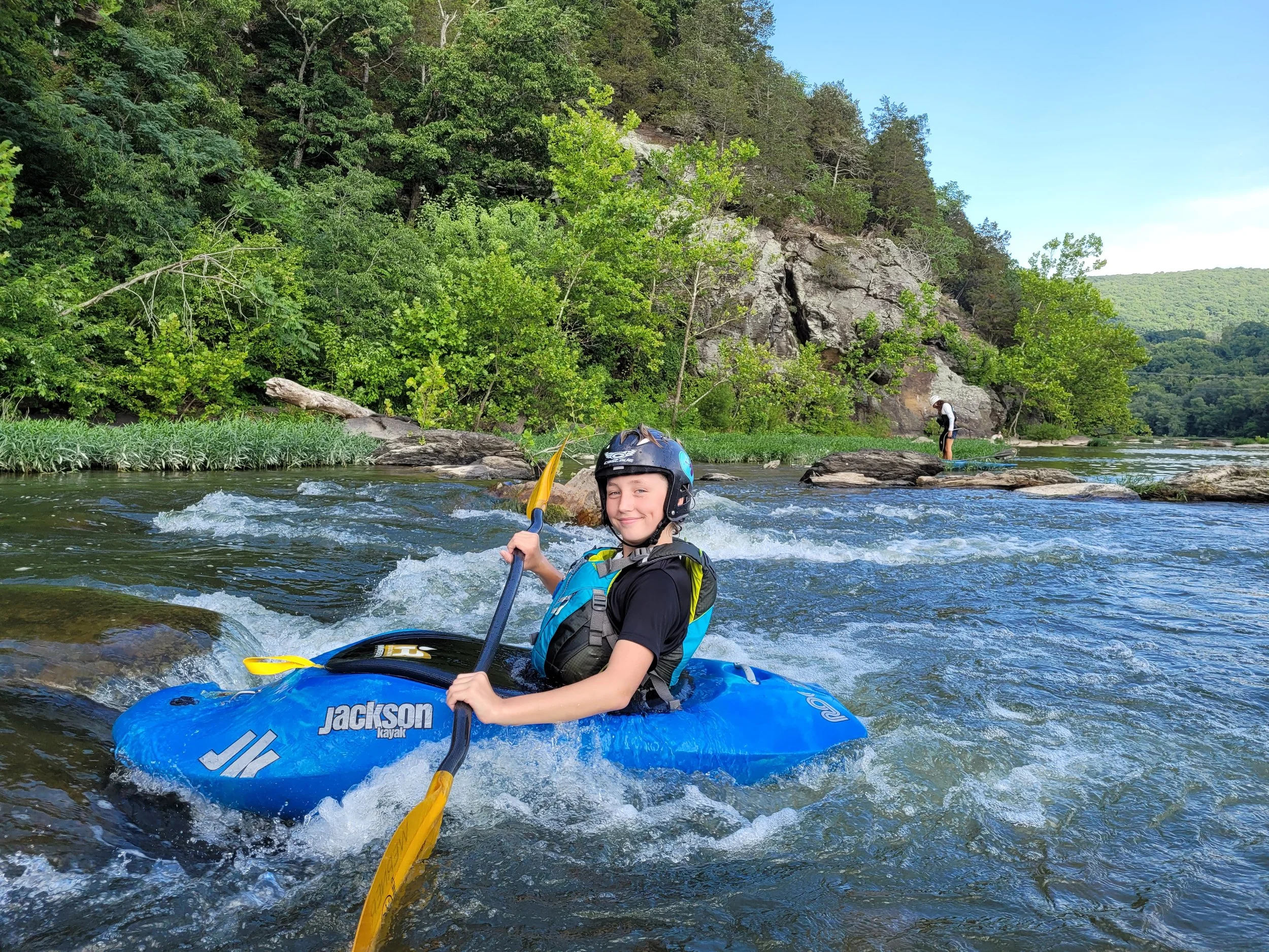 kid paddling a Jackson XS Rockstar Kayak