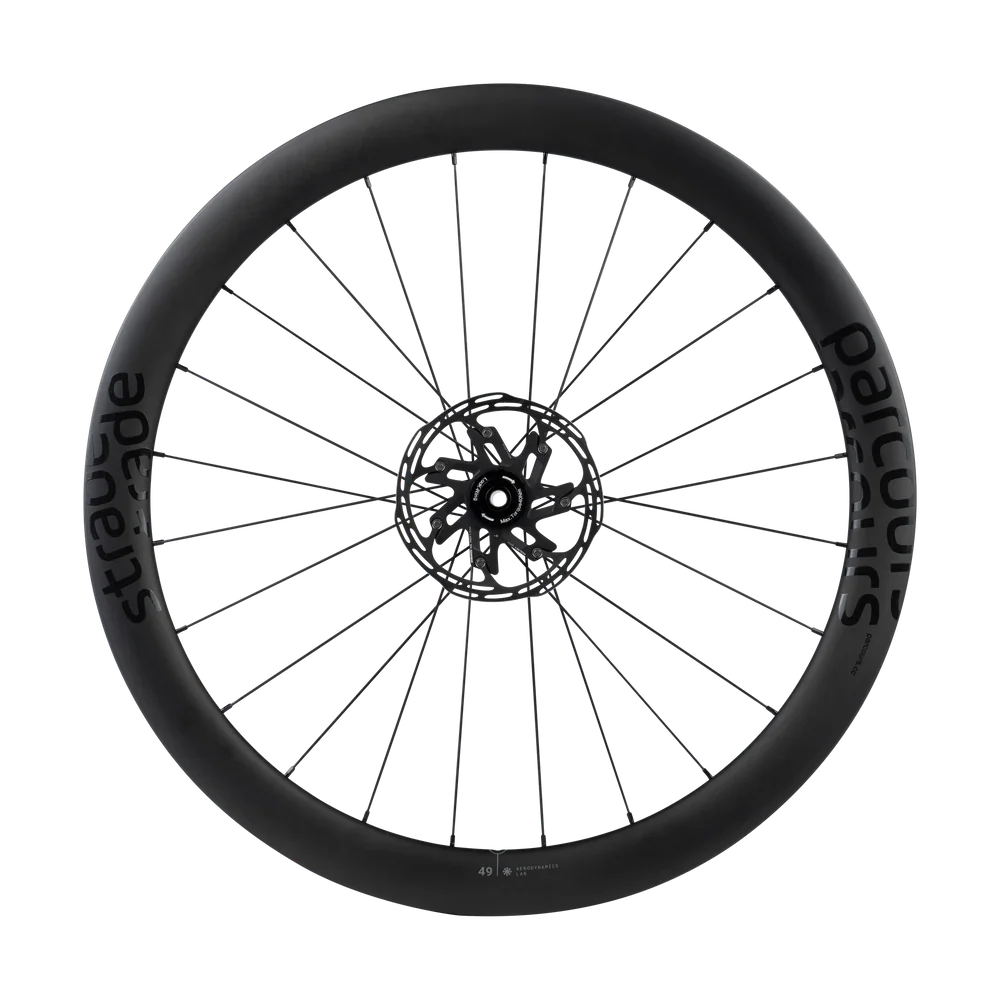 A bicycle wheel with a black tire that has the word 'Startaude' printed on it, and metal spokes connected to a central hub.