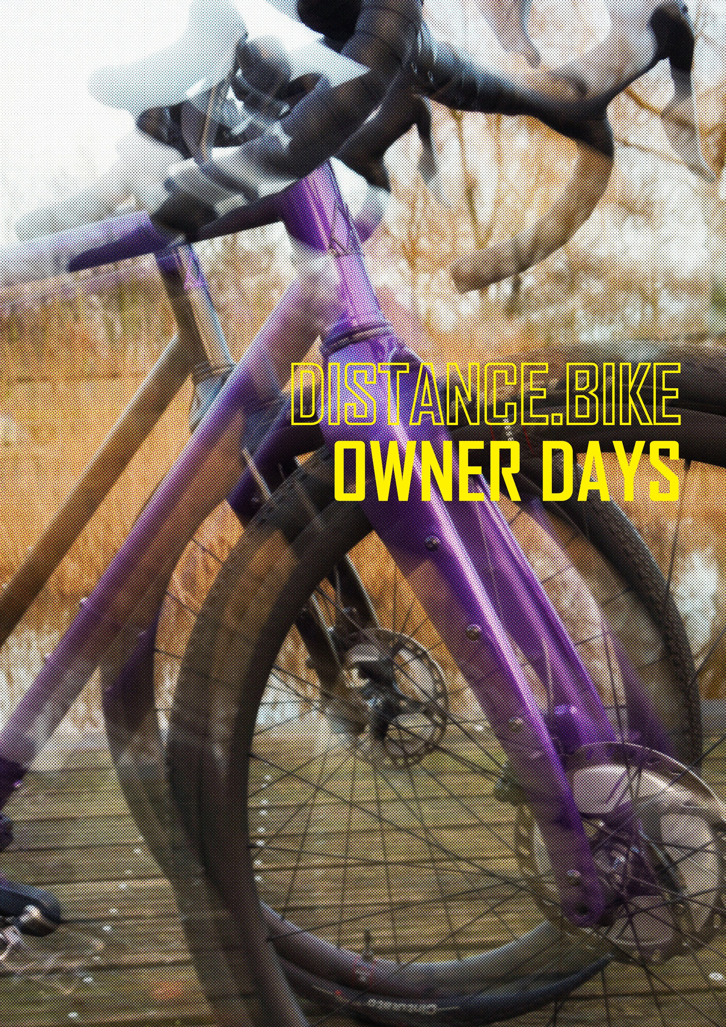 A purple mountain bike on a wooden trail with autumn-colored trees in the background, overlaid with yellow text reading "DISTANCE.BIKE OWNER DAYS".