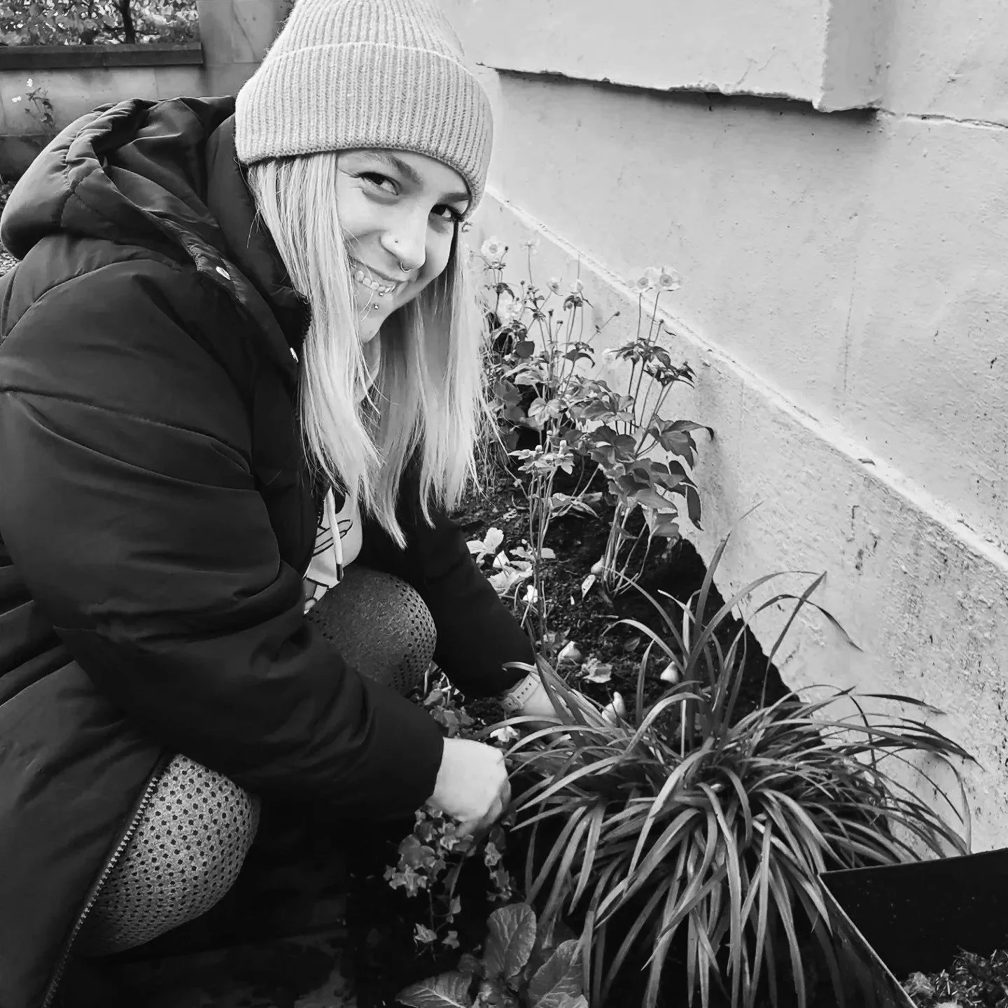 Happy gardener planting bulbs in Hyndland, Glasgow G12