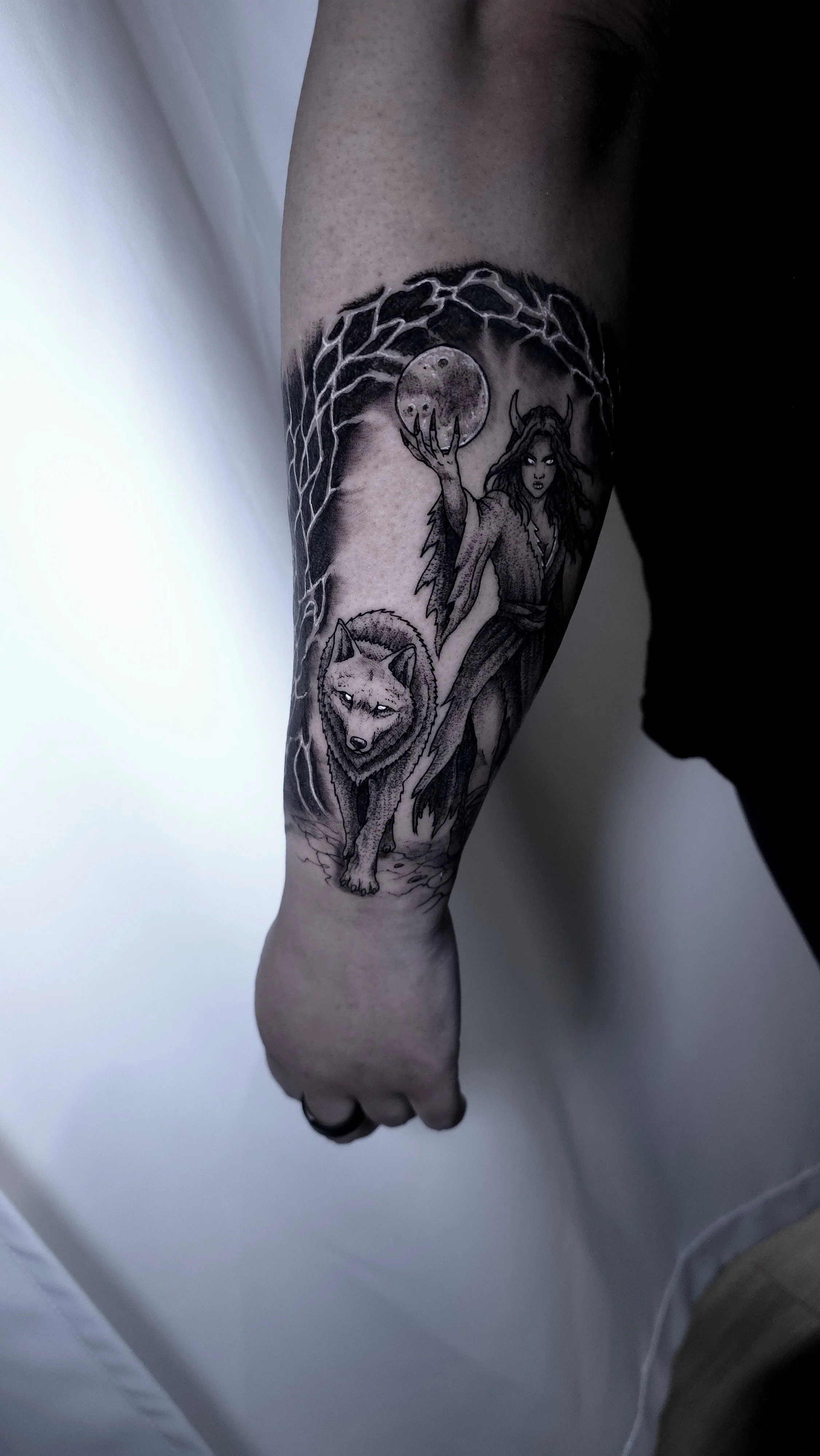 wolf-and-sorcerer-tattoo-on-forearm