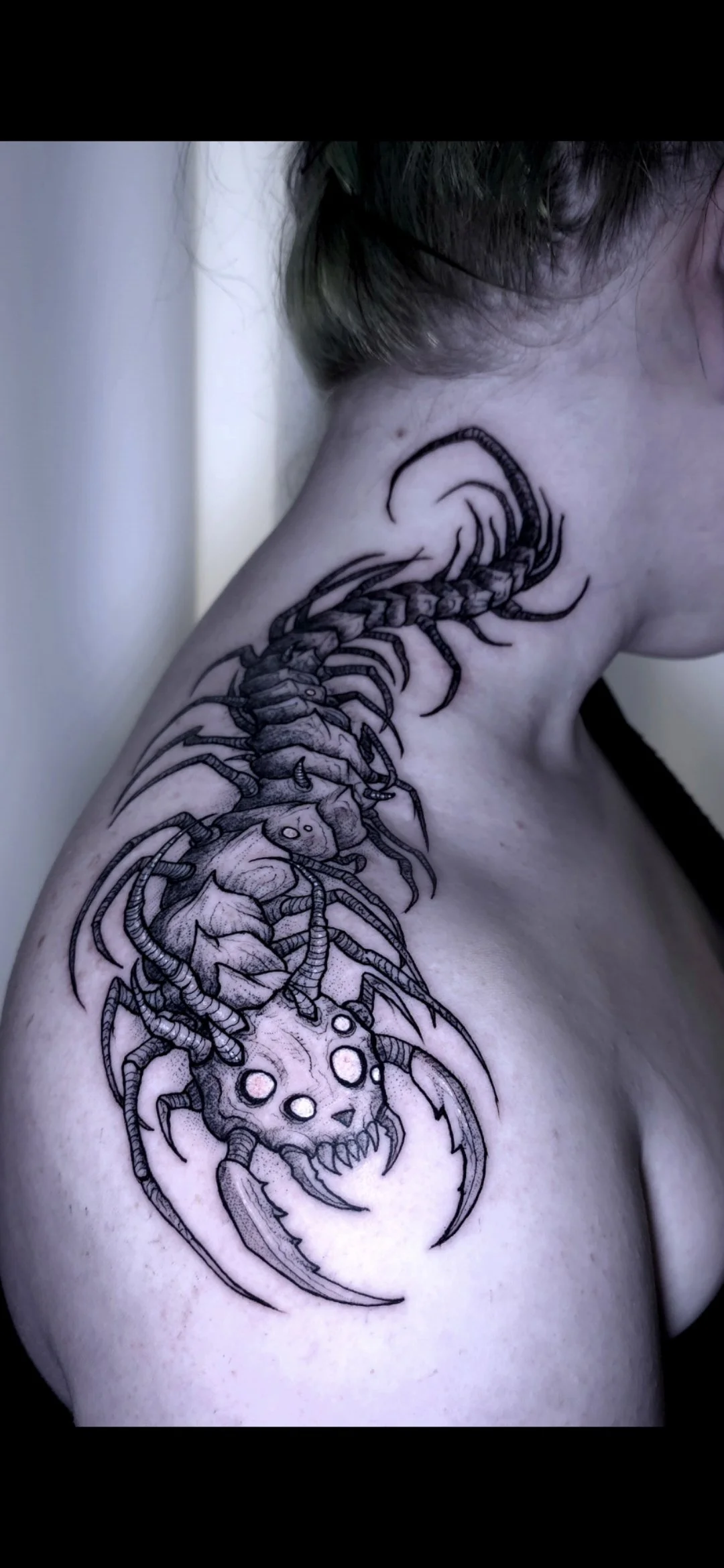 dark-centipede-tattoo-on-a-neck-and-shoulder