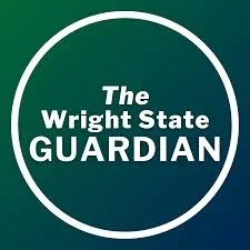Logo for The Wright State Guardian with white text inside a white circle on a green background.