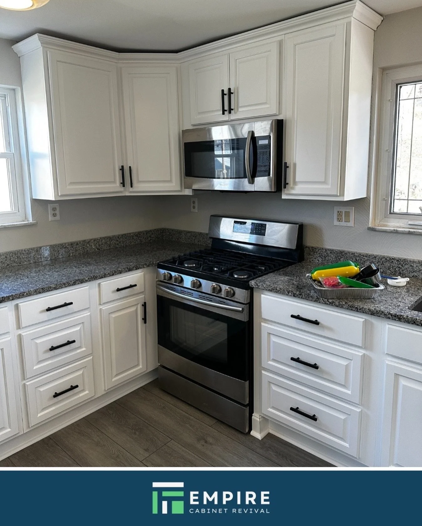 The layout worked, but the color didn&rsquo;t. We fixed that with a durable white coating. Now it looks like a completely different kitchen without the mess of construction.

|| empirecabinetrevival.com