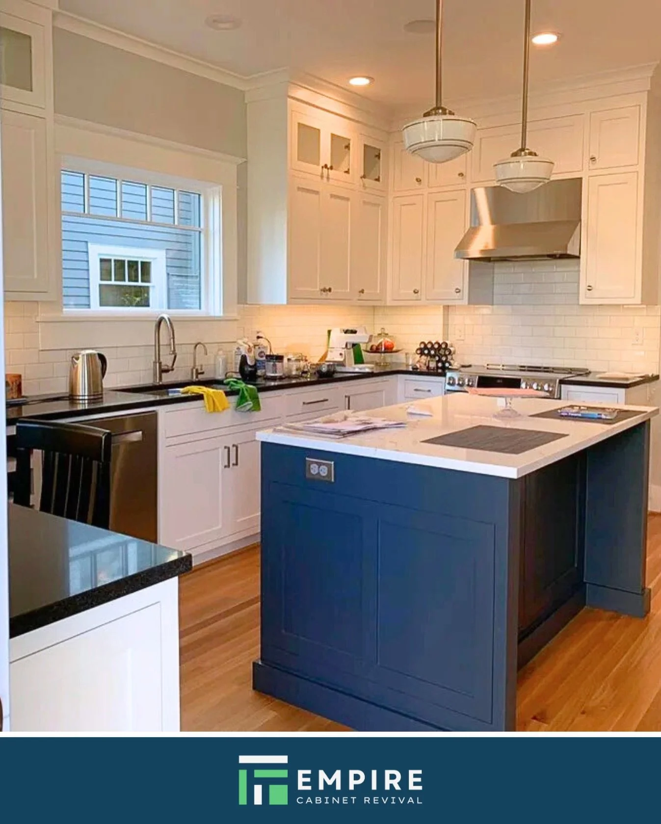 You don&rsquo;t have to stick to just one color. This kitchen shows how well crisp white cabinets pair with a dark blue island. It adds depth and character while keeping the room bright. A custom look, done the practical way.

|| empirecabinetrevival