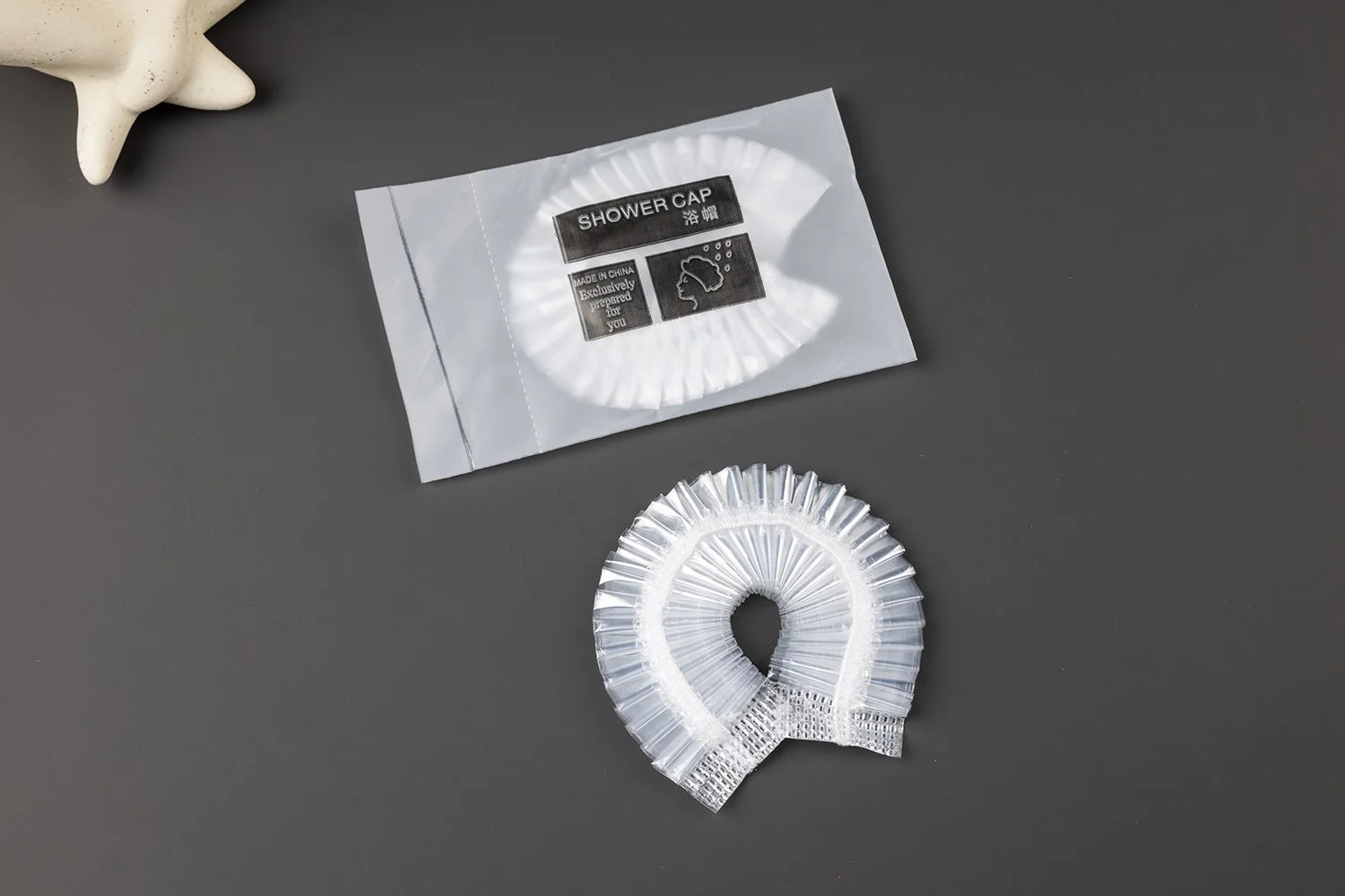 SC-001　シャワーキャップ
フリーサイズ／素材：PEフィルム／透明タイプ／個包装：印刷入り袋または無地袋