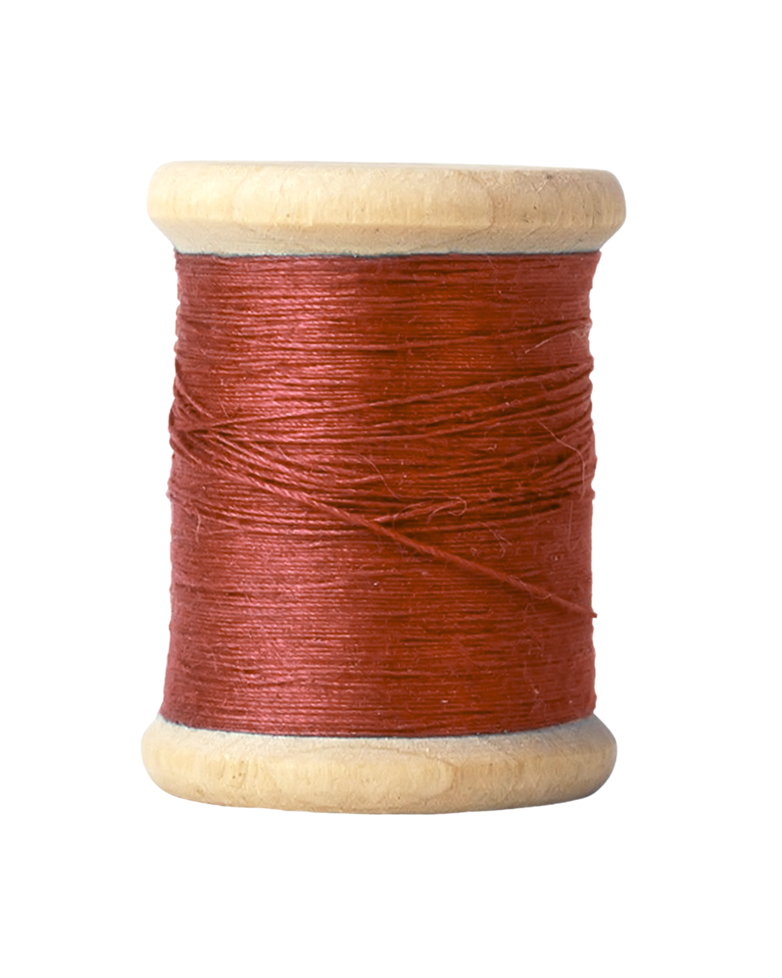 A spool of red sewing thread wound around a light-colored wooden reel.