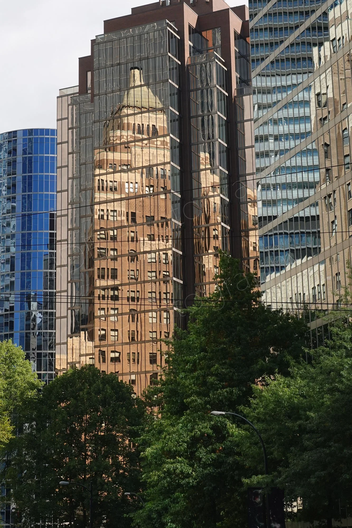 Reflections on glass covered skyscraper buildings in Vanvcouver.