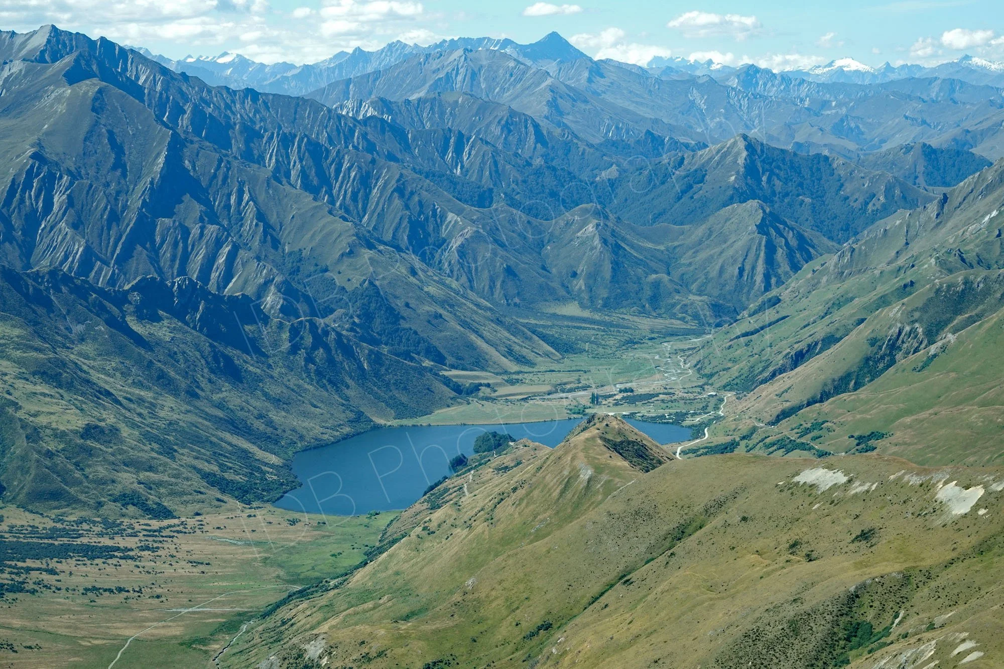 Aerial view of rugged mountains and lake between Glenorchy and Milford Sound, Otago, New Zealand.