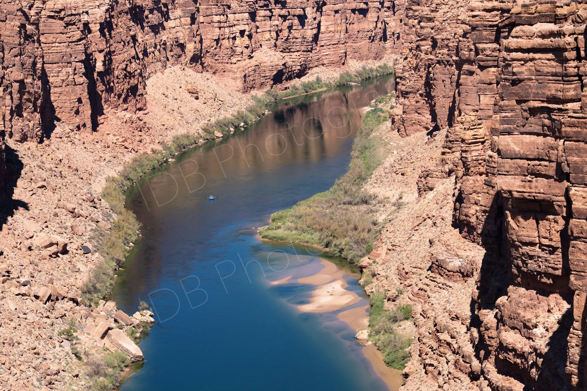 The Colorado River from Navajo Bridge as it flows through the deep, steep-walled red rock gorge of Marble Canyon in northern Arizona.