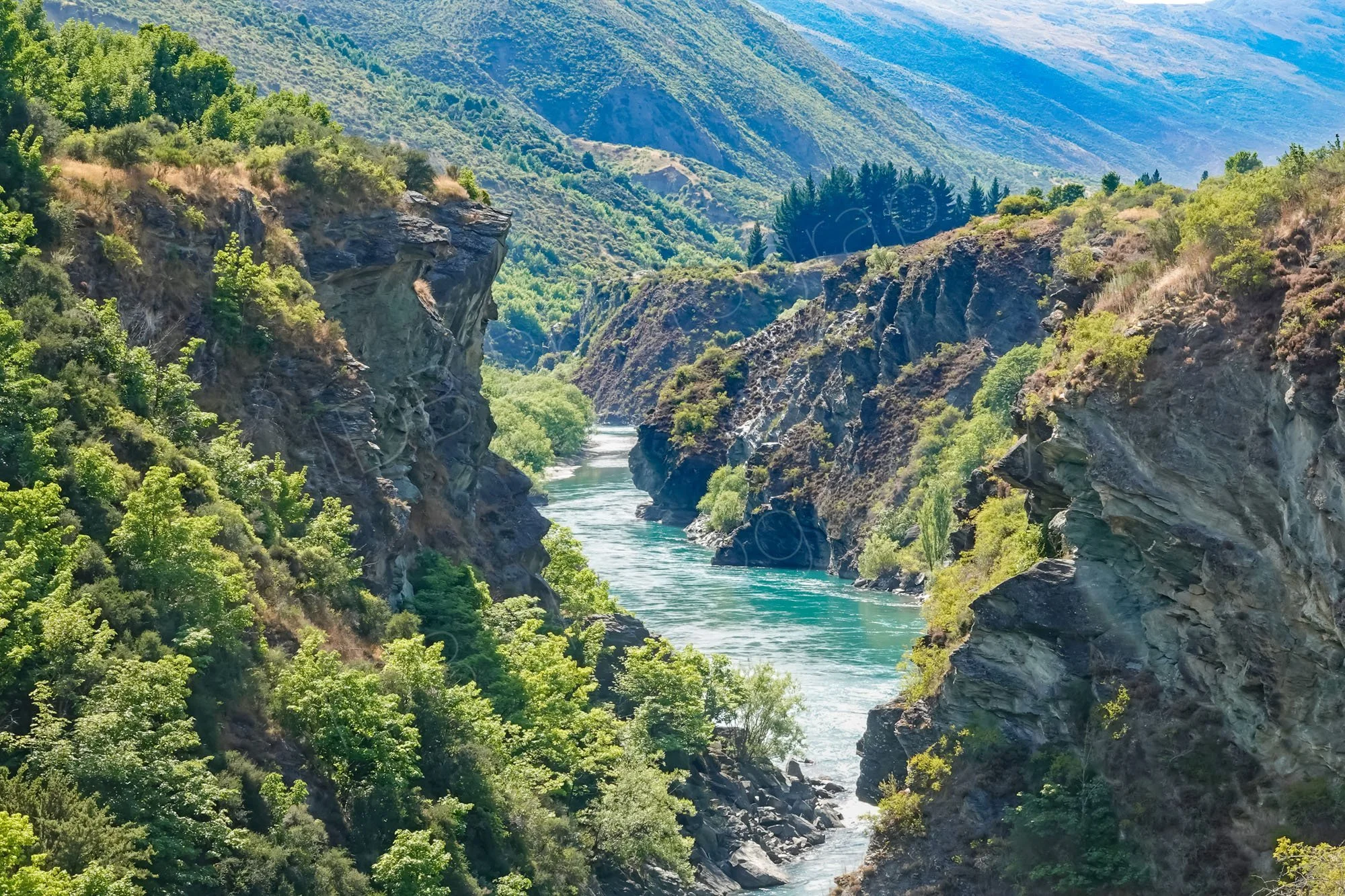 Kawarau Gorge, Otago, New Zealand. Beautiful irregular rocky river gorge with vegetation.