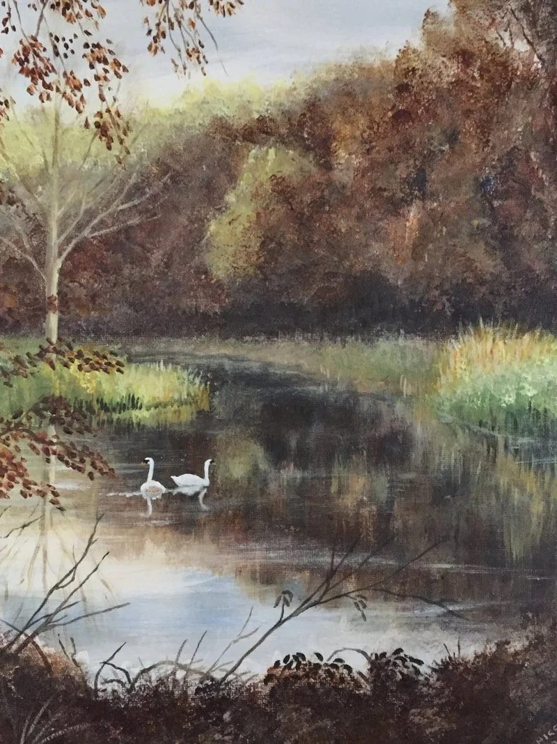 A painting of a serene landscape featuring a river with two white swans swimming, surrounded by trees with autumn-colored leaves and lush green foliage.