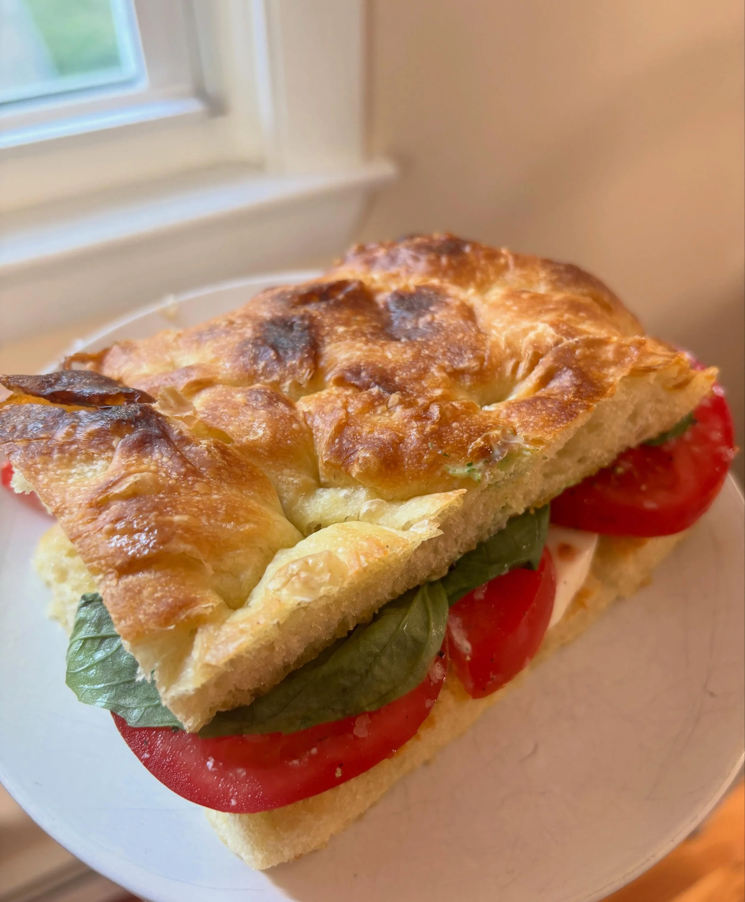 I can&rsquo;t think of a better way to use our focaccia than a caprese sando with basil mayo. YUM! #massachusettsbakery #nashobavalley #worcester #metrowest #saltboxbakingco