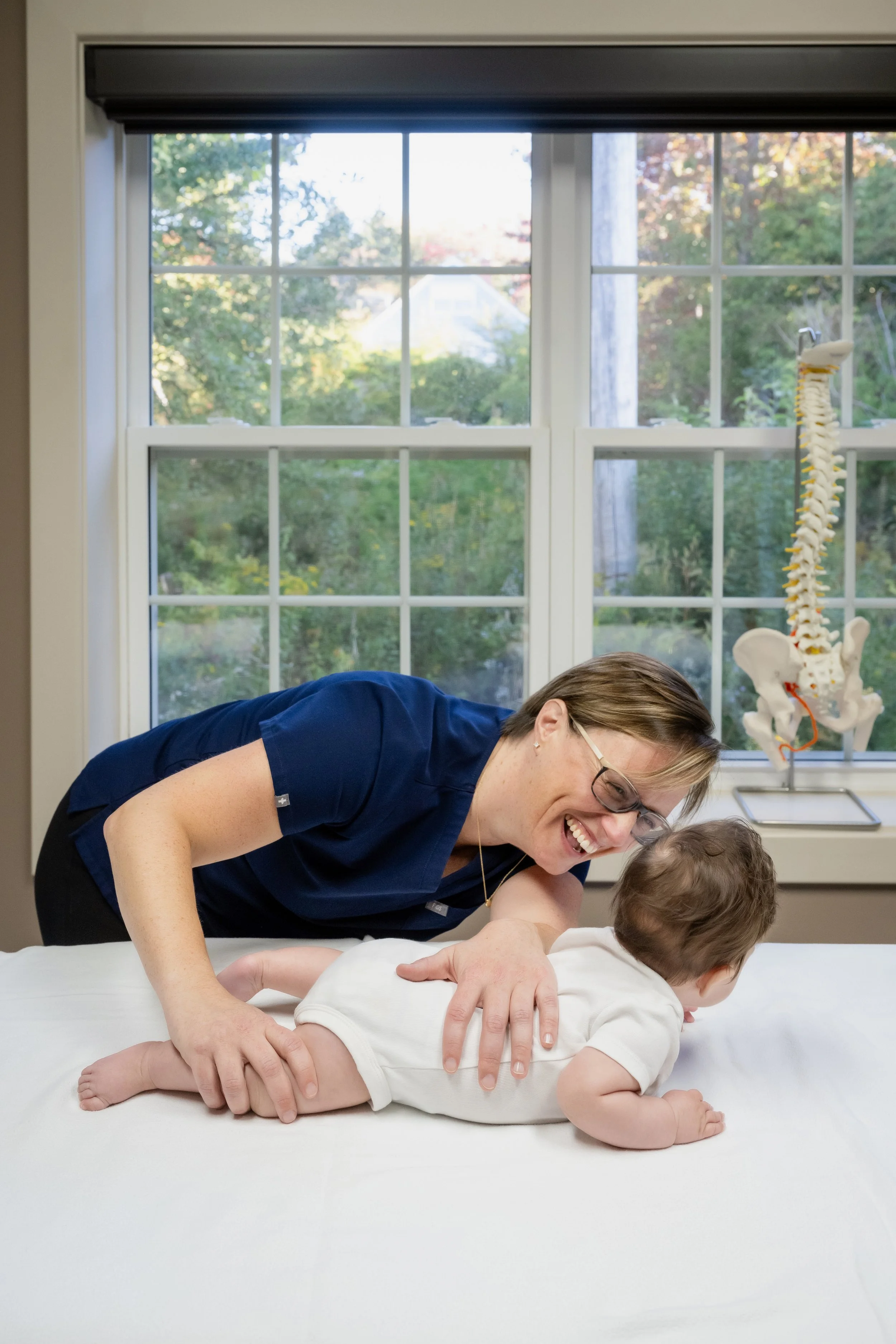 Osteopath Kaitlyn Sobey working with a baby on head and neck movement