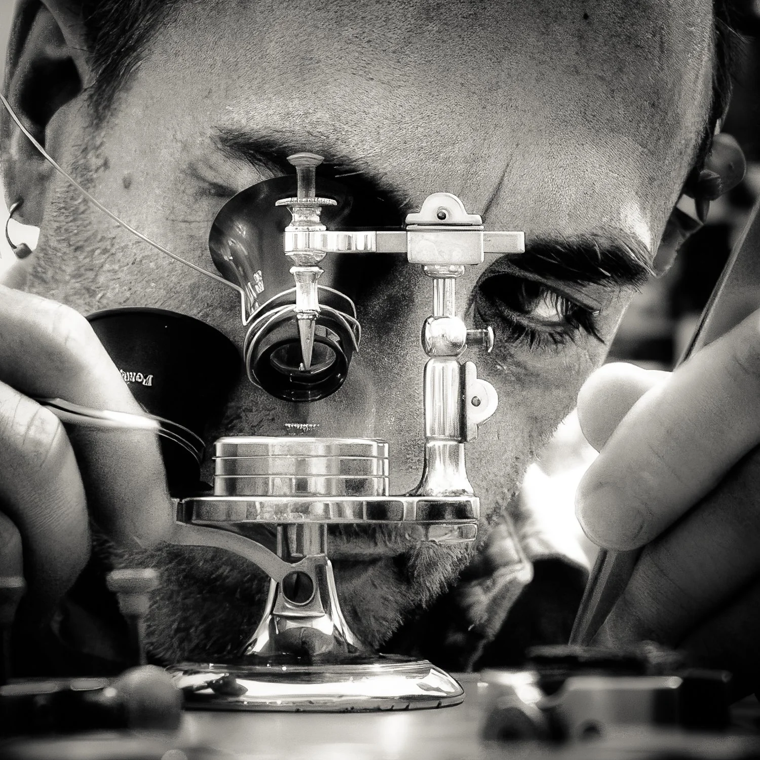 A person using an ophthalmic instrument to examine their eye.