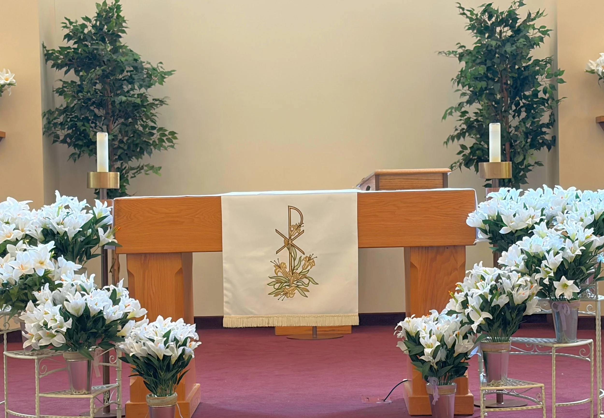 APLC's  Altar with Easter Lilies cascading down the left and right sides