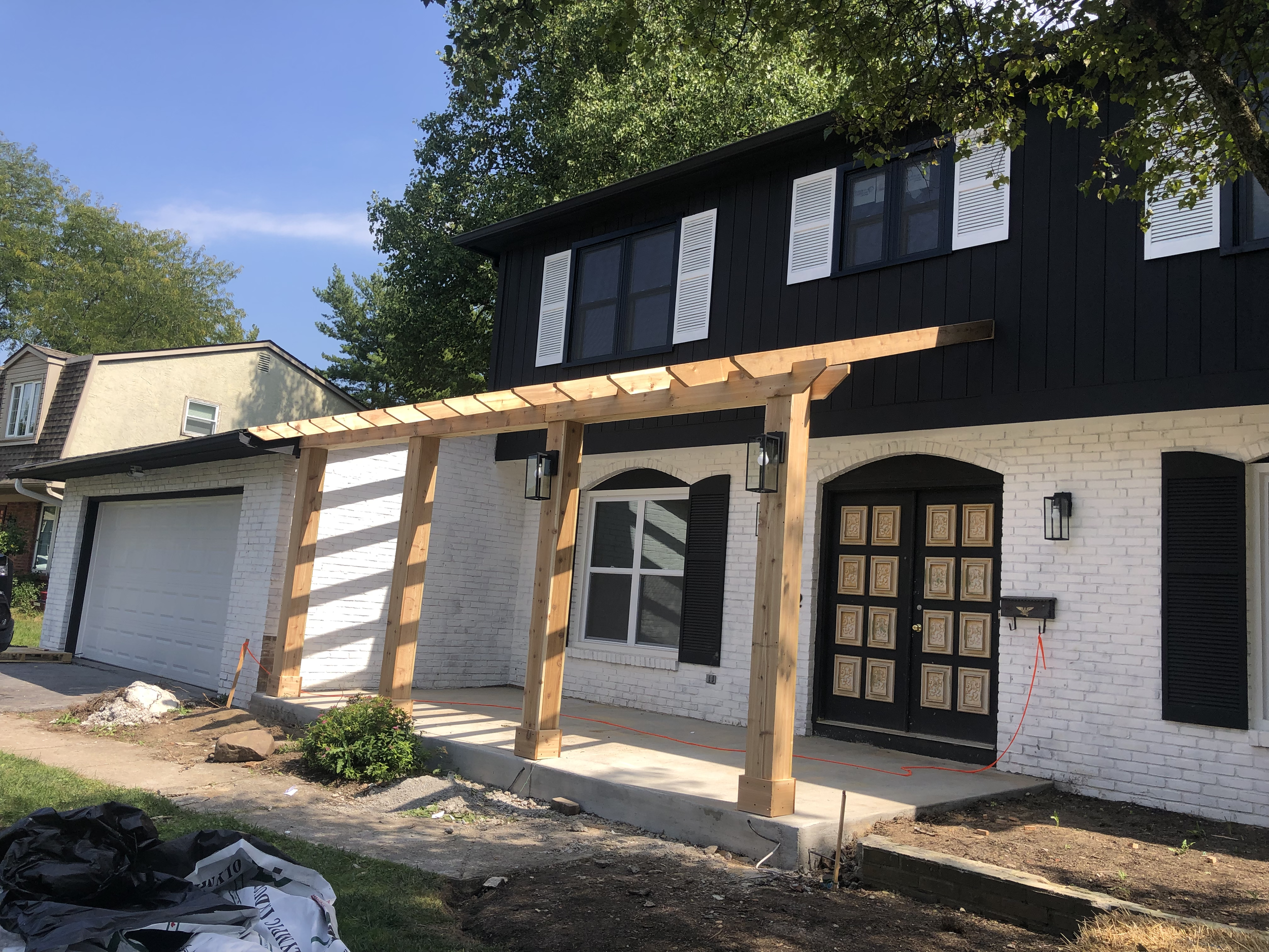 Fully remodeled home with added front pergola mid progress