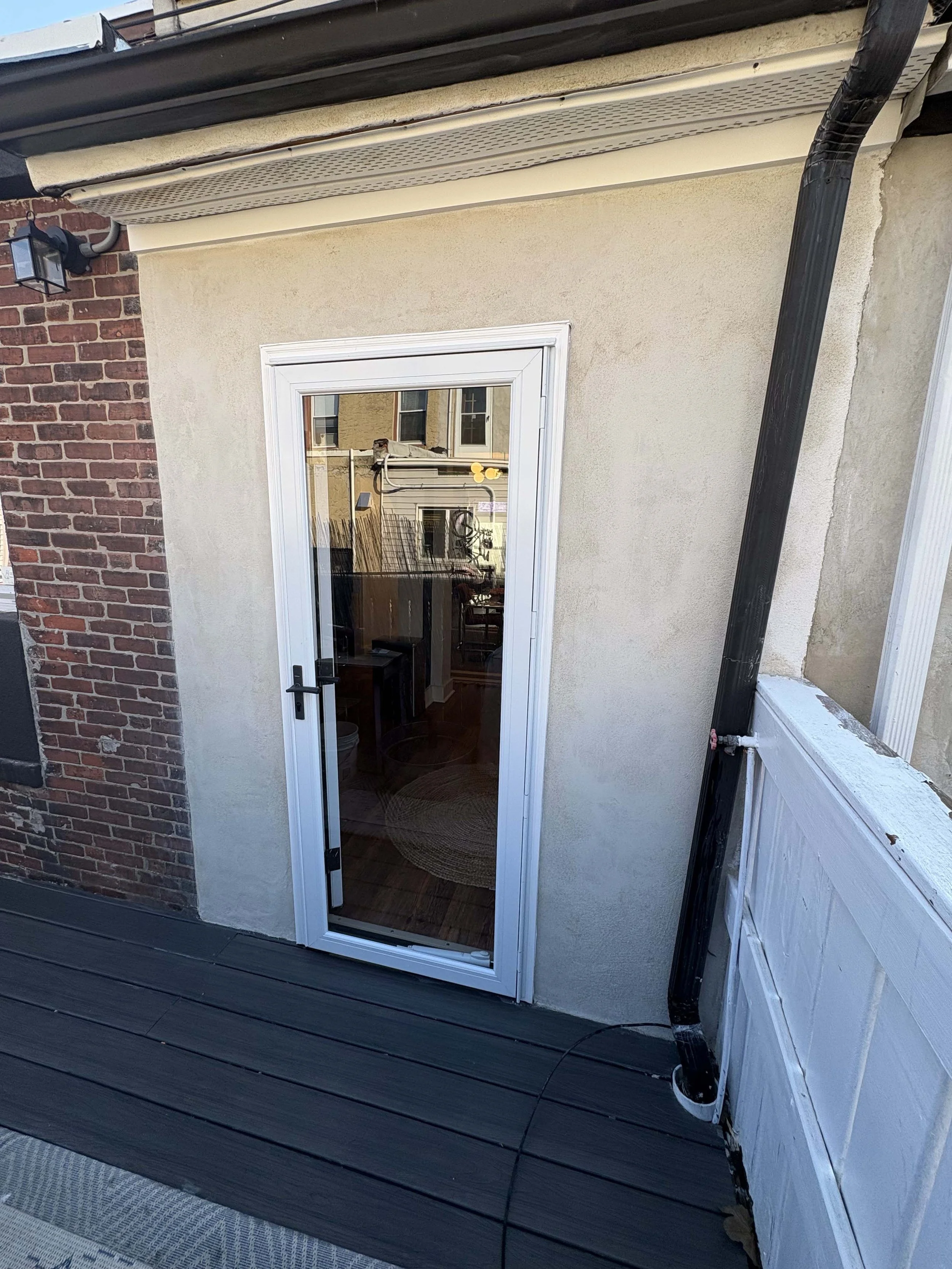 After - New exterior fiberglass door and glass storm door