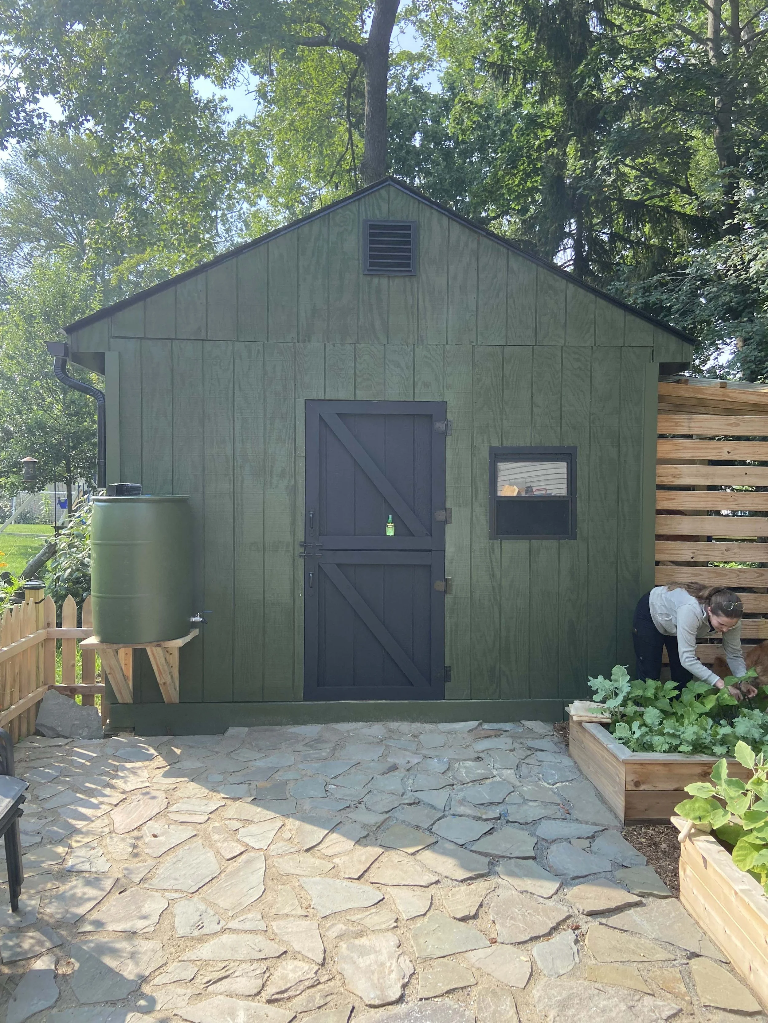 After - Installed new shingles/underlayment, gutter system to water the garden, new hand-crafted barn door. Loft area installed inside shed, increasing storage and accessibility. Stone pathway with polymeric sand.