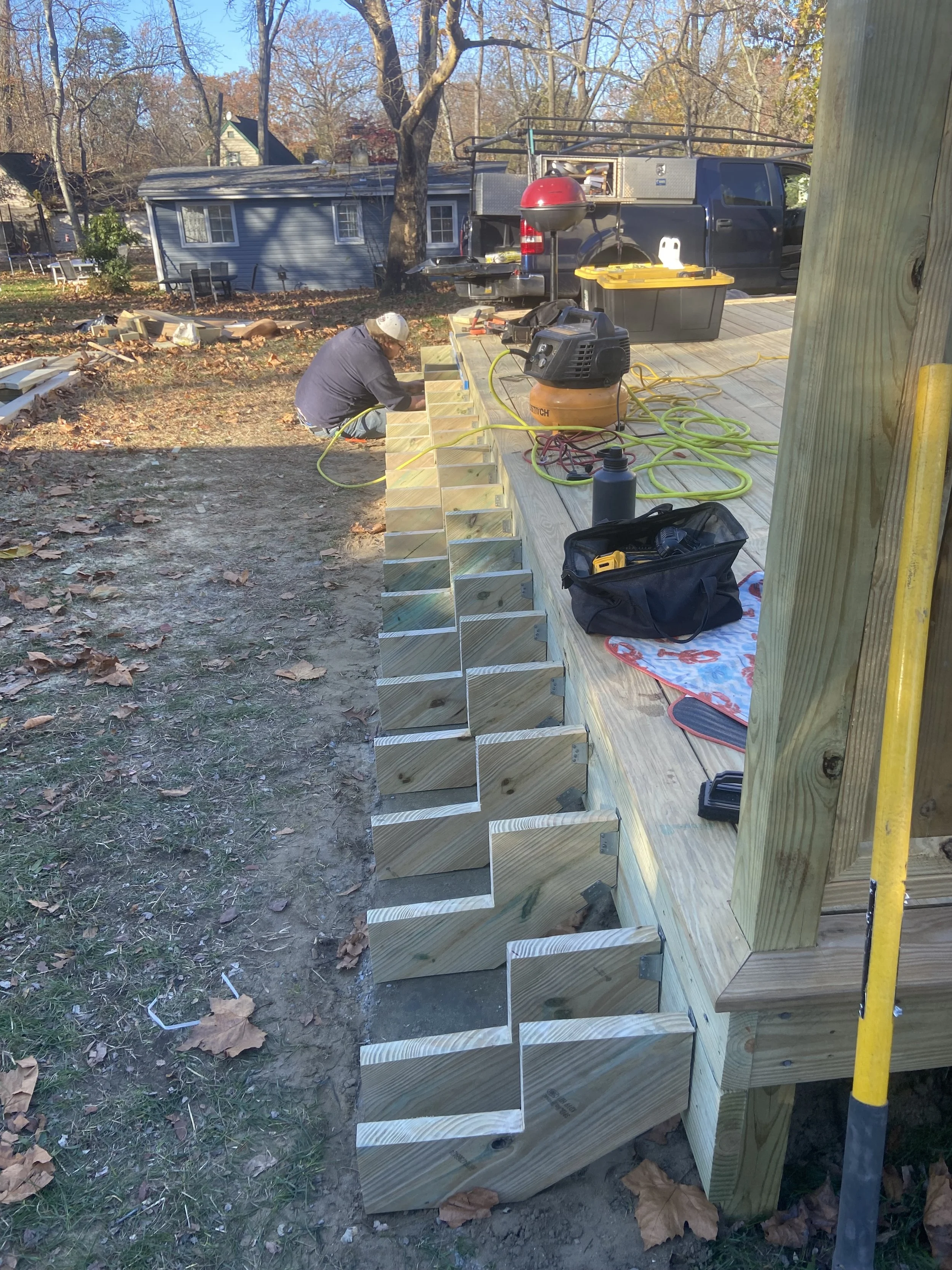 During - Placing custom stringers on the 22-foot long concrete pad