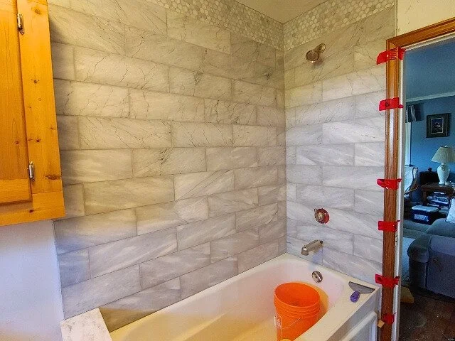 Marbled tile shower.