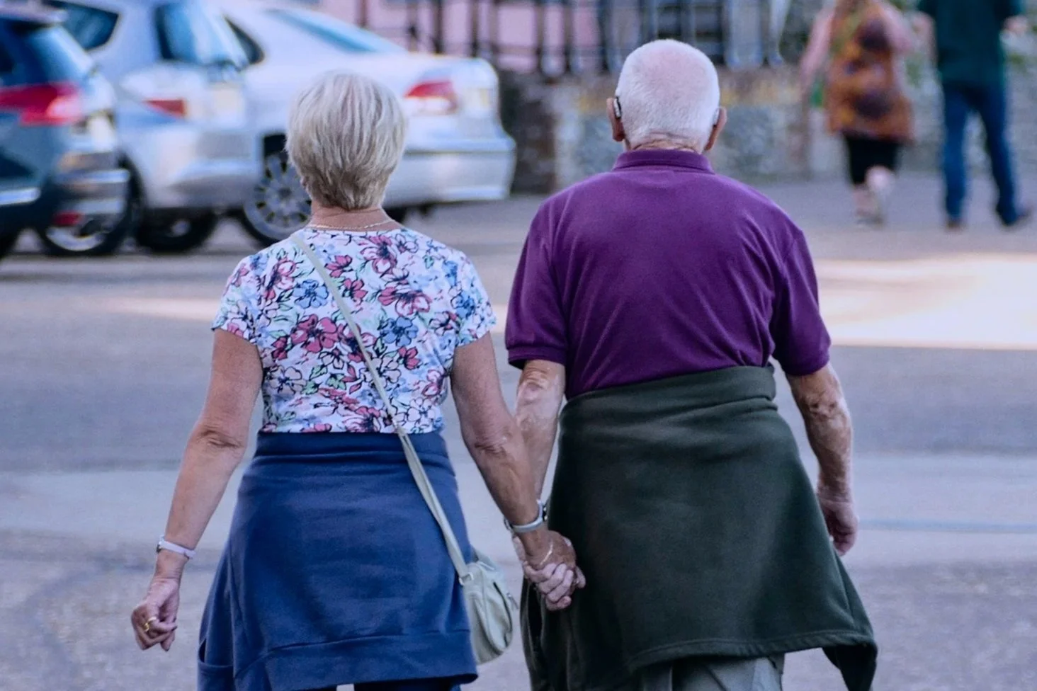 Couple walking outdoors for daily movement and wellness