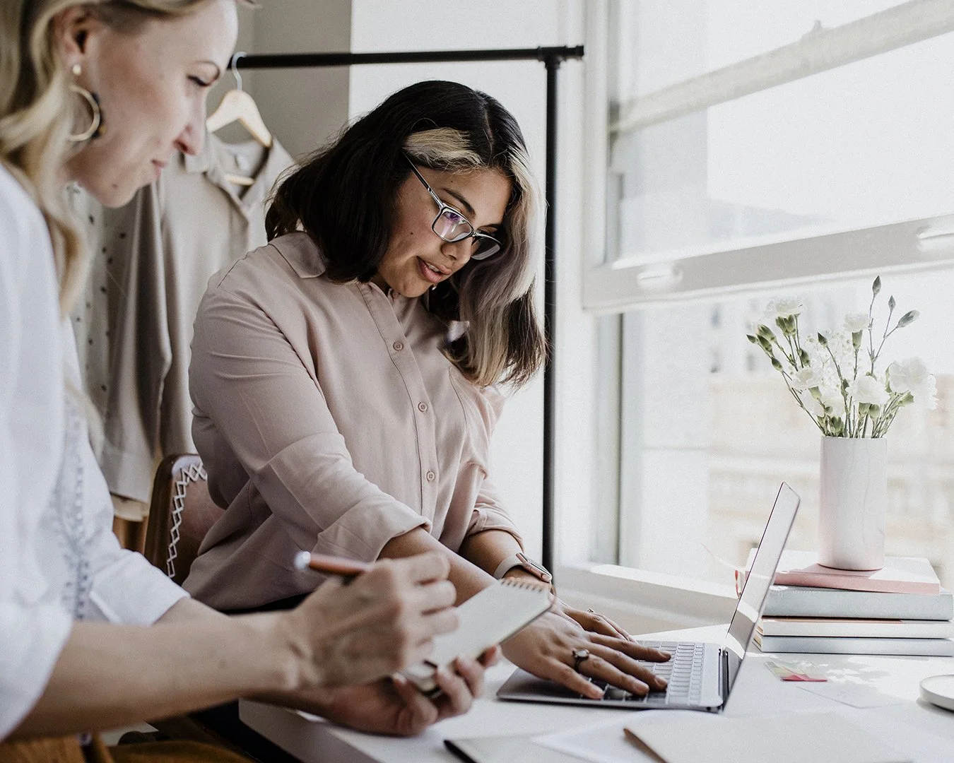 Two women working together on business