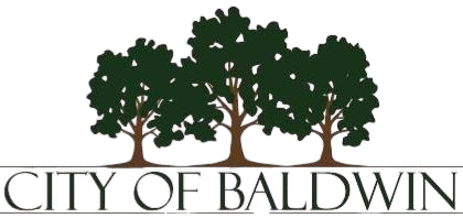 A logo featuring three green trees above the text 'OCT. BALDWIN' with a stylized green and brown design.