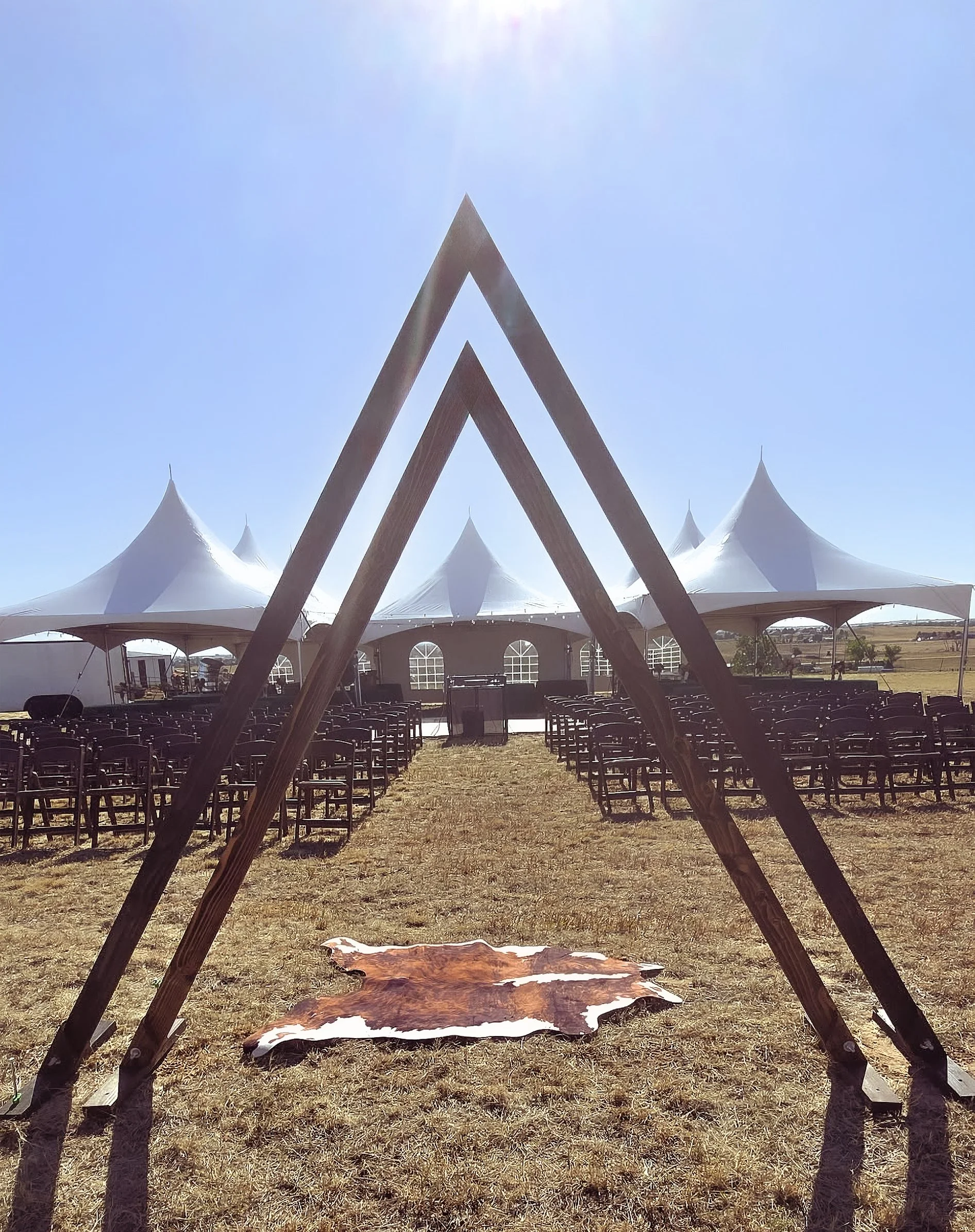 Triangle Arch And High Peak Tents In Brighton, Colorado