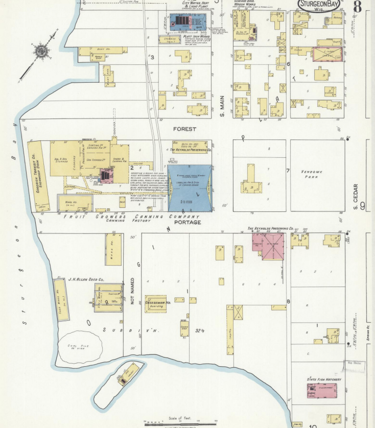 A historical map of Sturgeon Bay, Wisconsin, showing various buildings, streets, and landmarks including breweries, factories, and wharves, with labels for streets like S. Main, S. Cedar, and Portage.