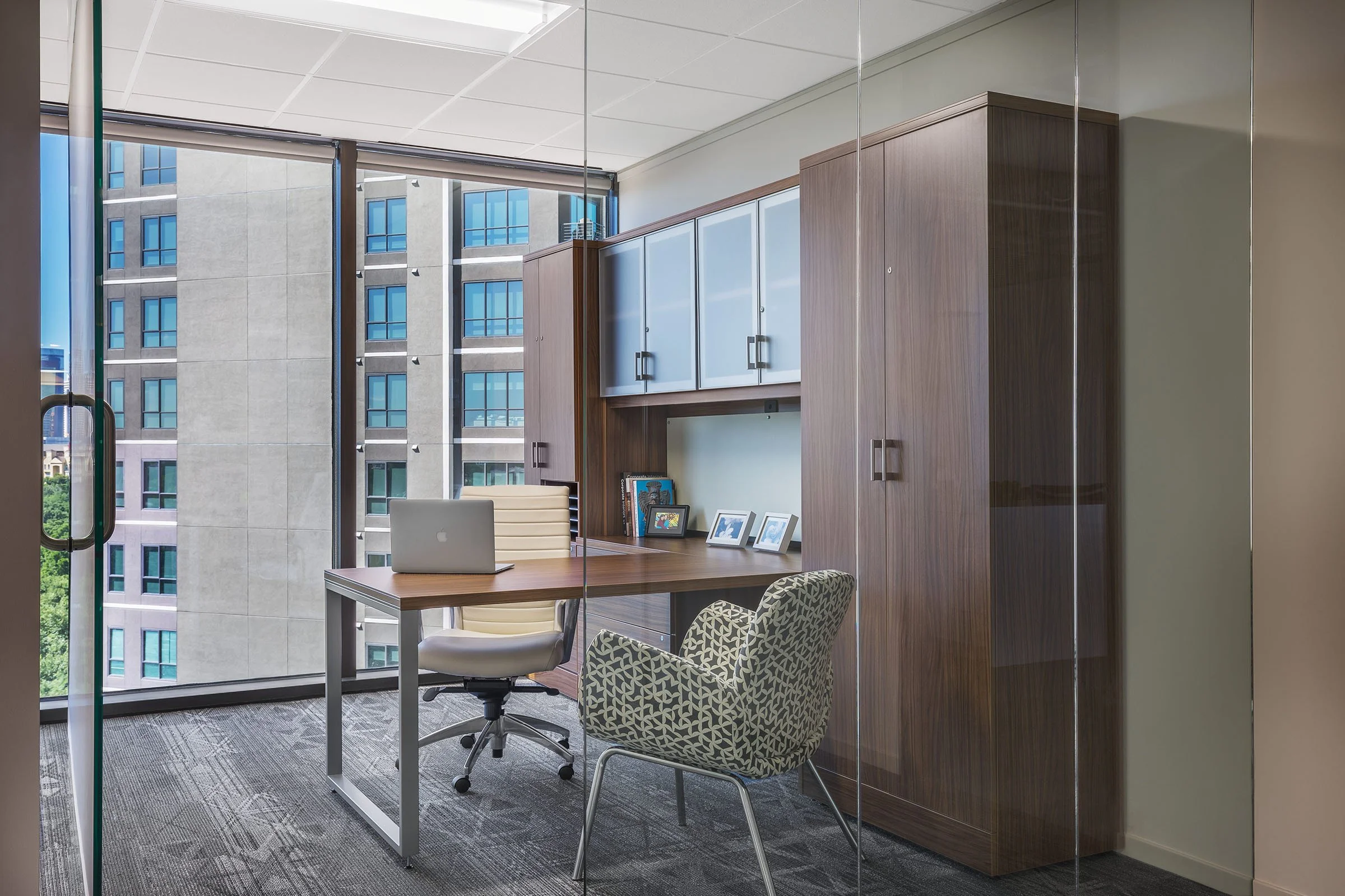 Kate seating in One McKinney office