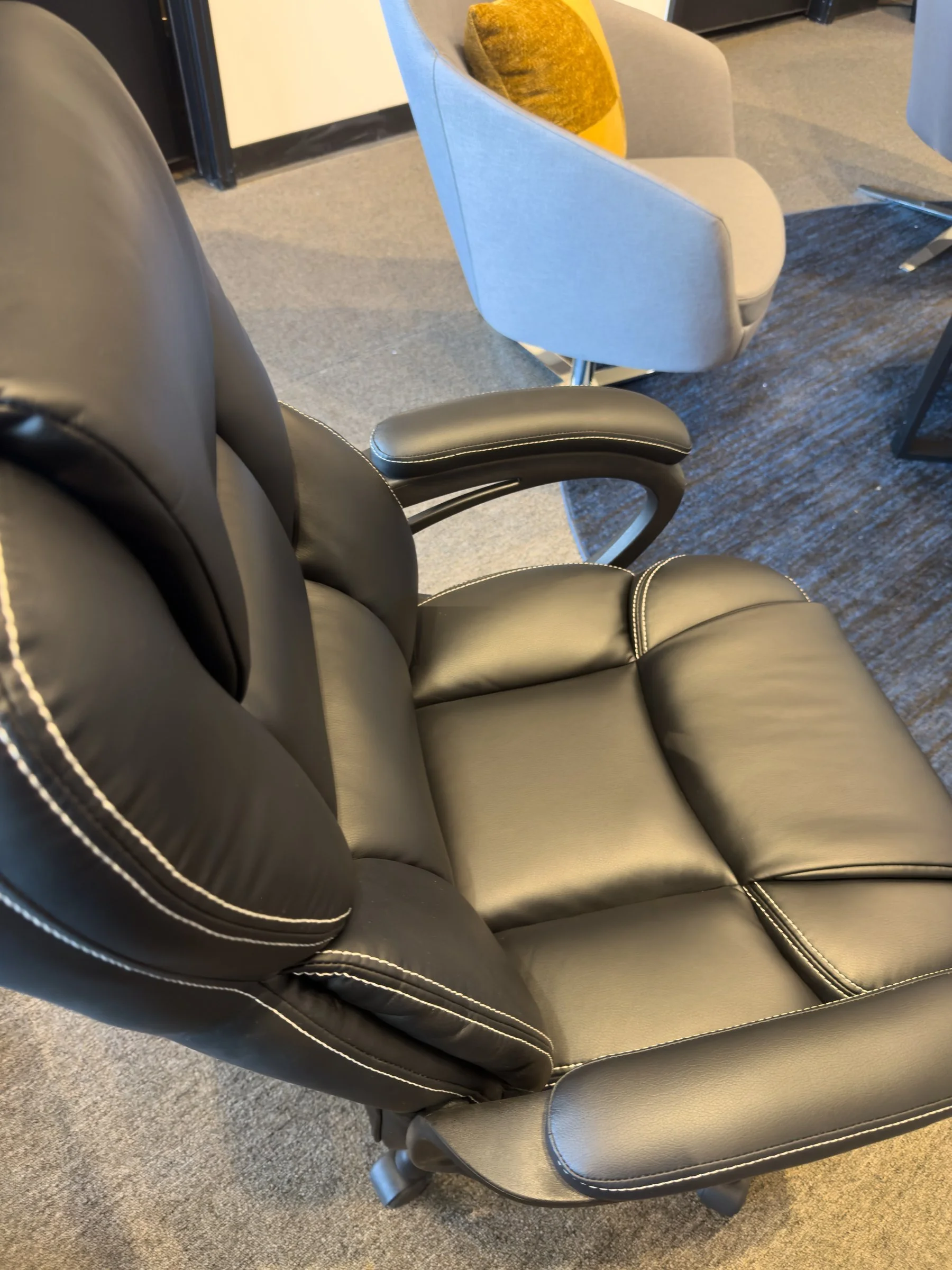 7PC Conference Package — black leather chair with white contrast stitching