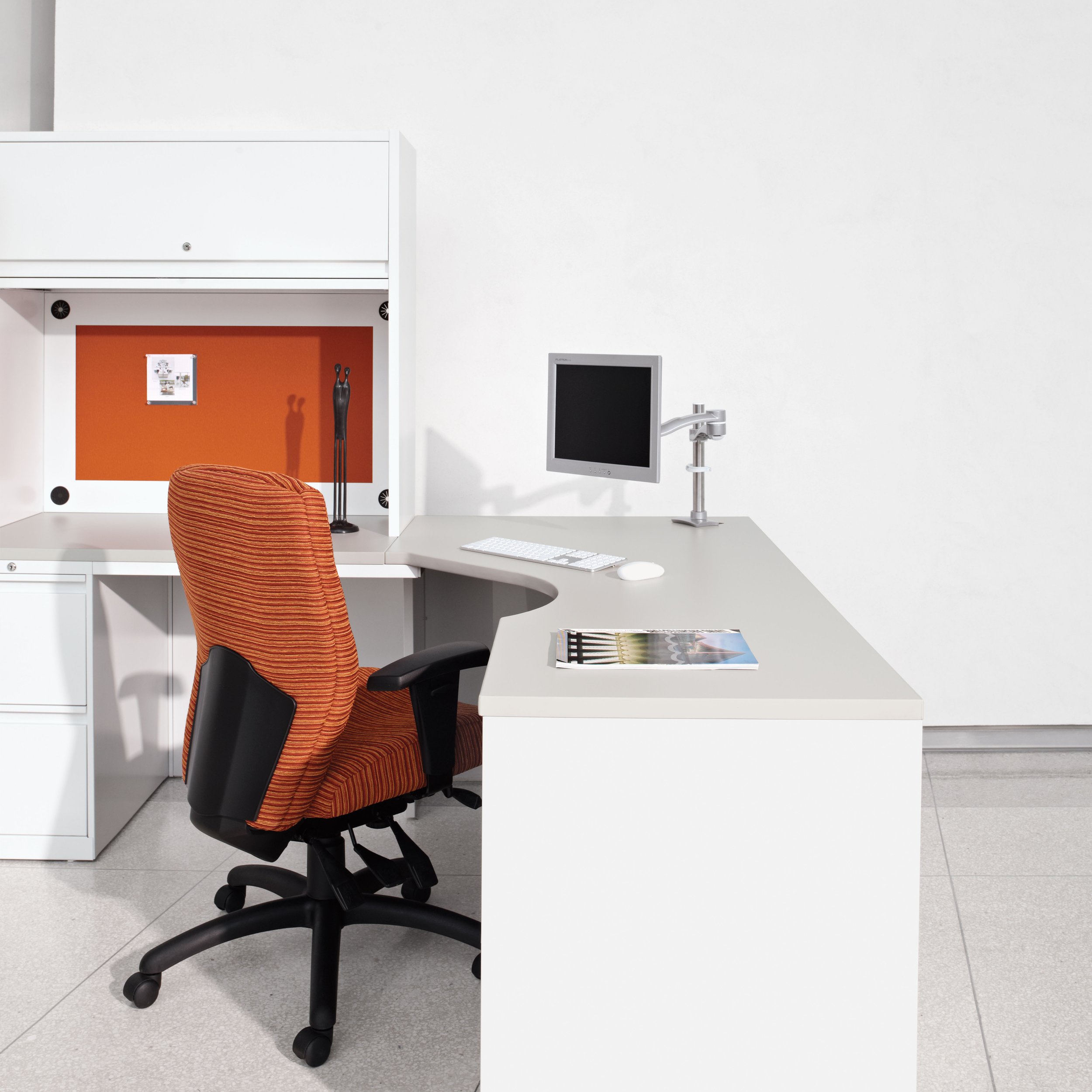 Synopsis — orange task chair at workstation