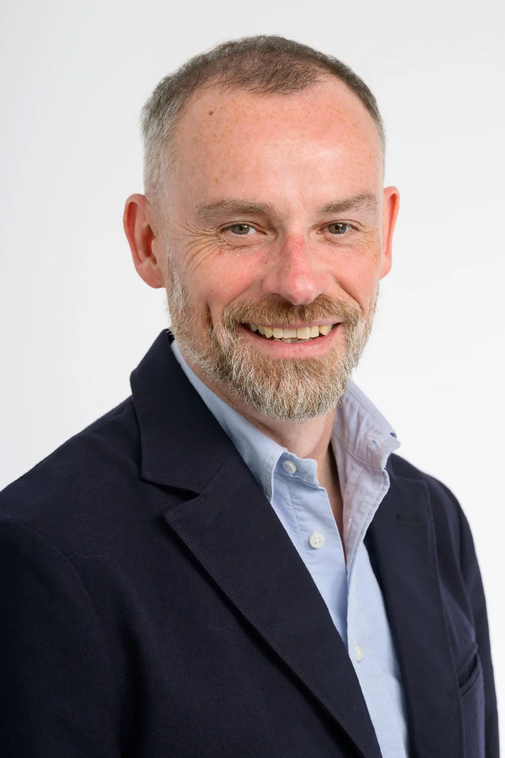 High-quality professional headshot captured by Ian Georgeson Photography in a modern studio setting.