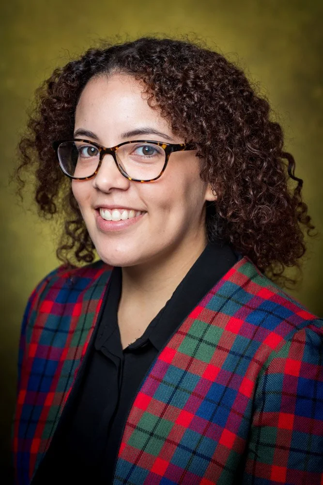 Vibrant, brightly lit headshot of a young professional