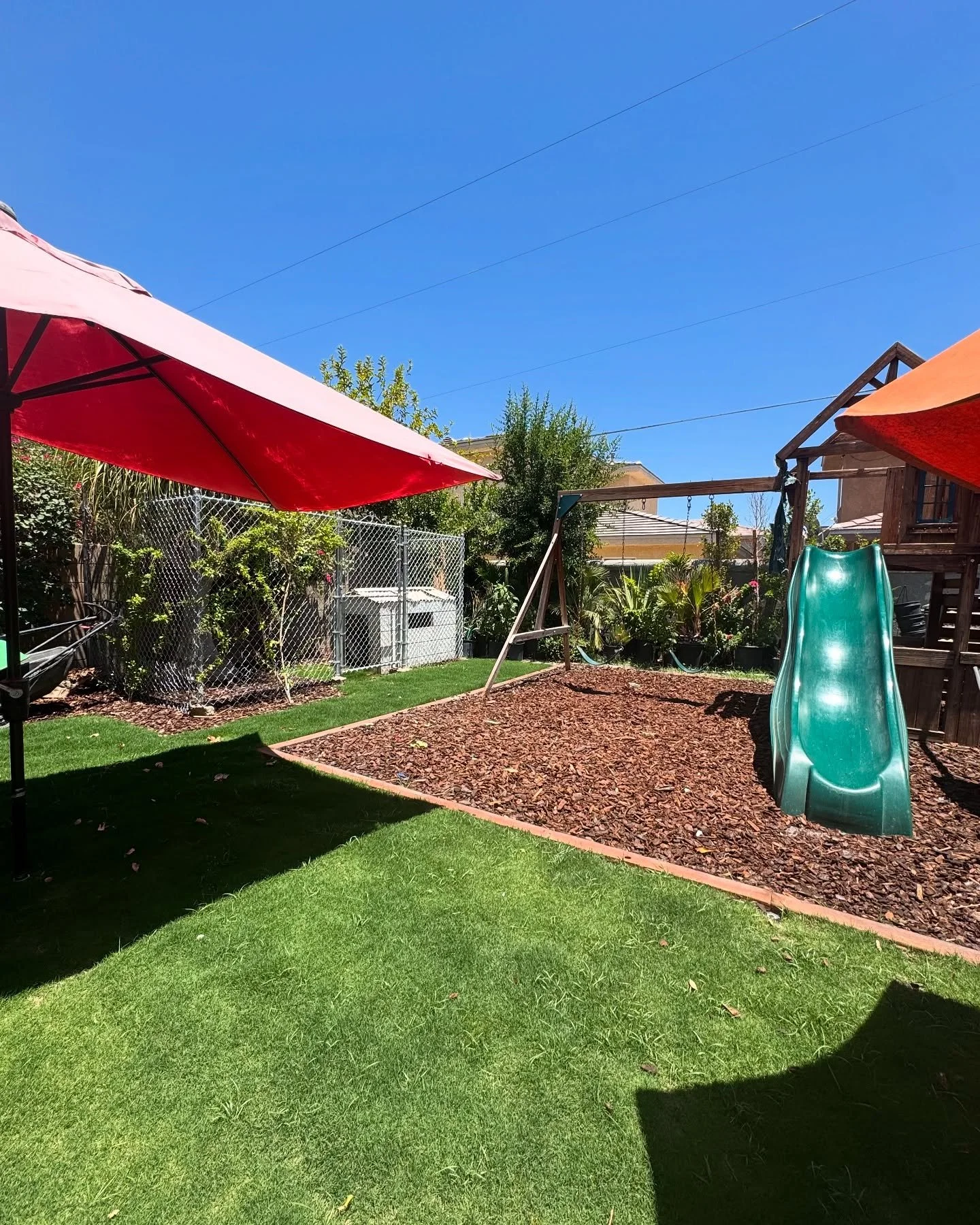 Feeling like your backyard is too small? Think again. ⬇️

This backyard went from a small space to an area full of life 🌿

🌱 Natural grass cools your environment and creates an inviting area. 
🪵 Mulch acts as a great playground flooring, with opti