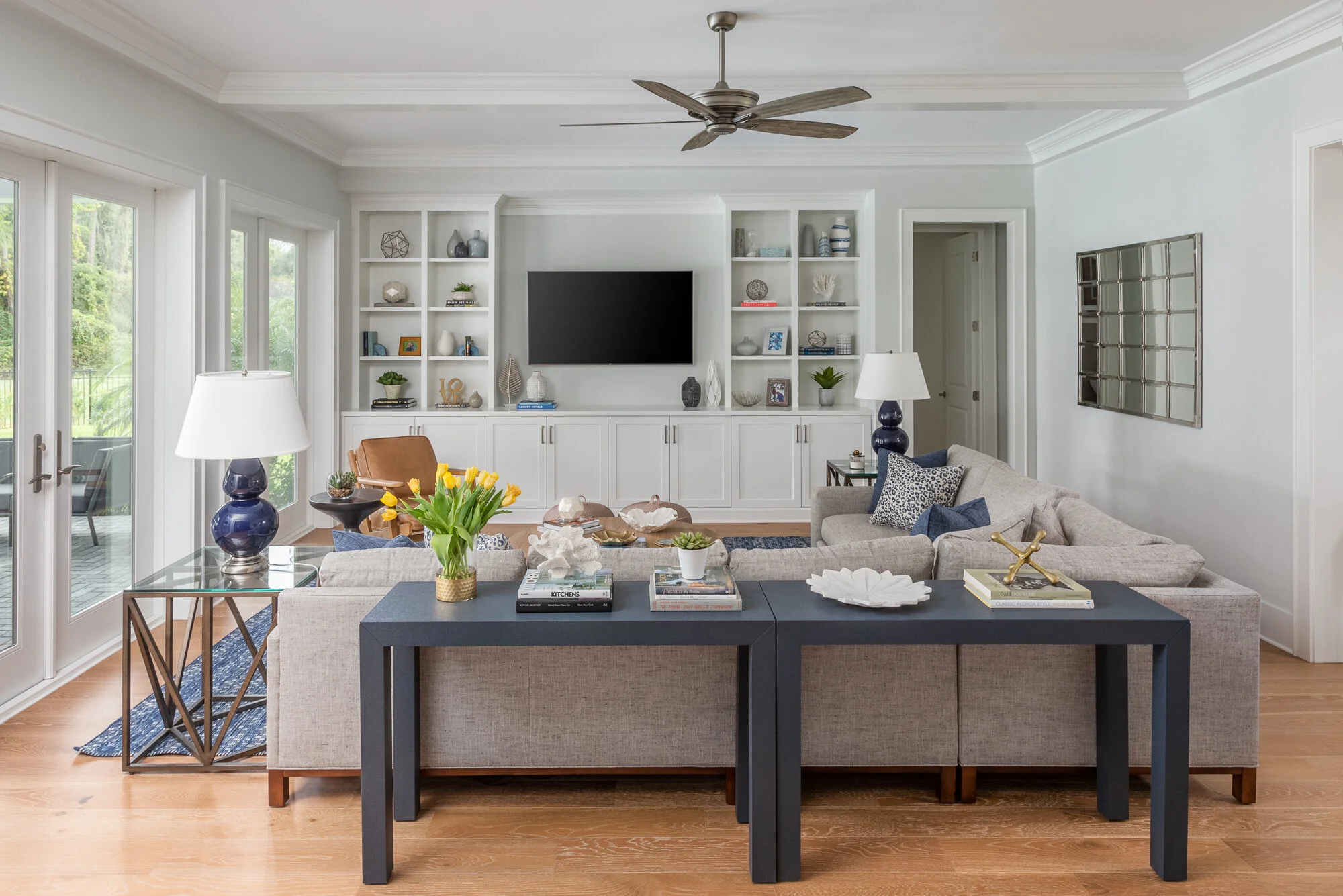 White built in tv console wood, grey, and blue accents