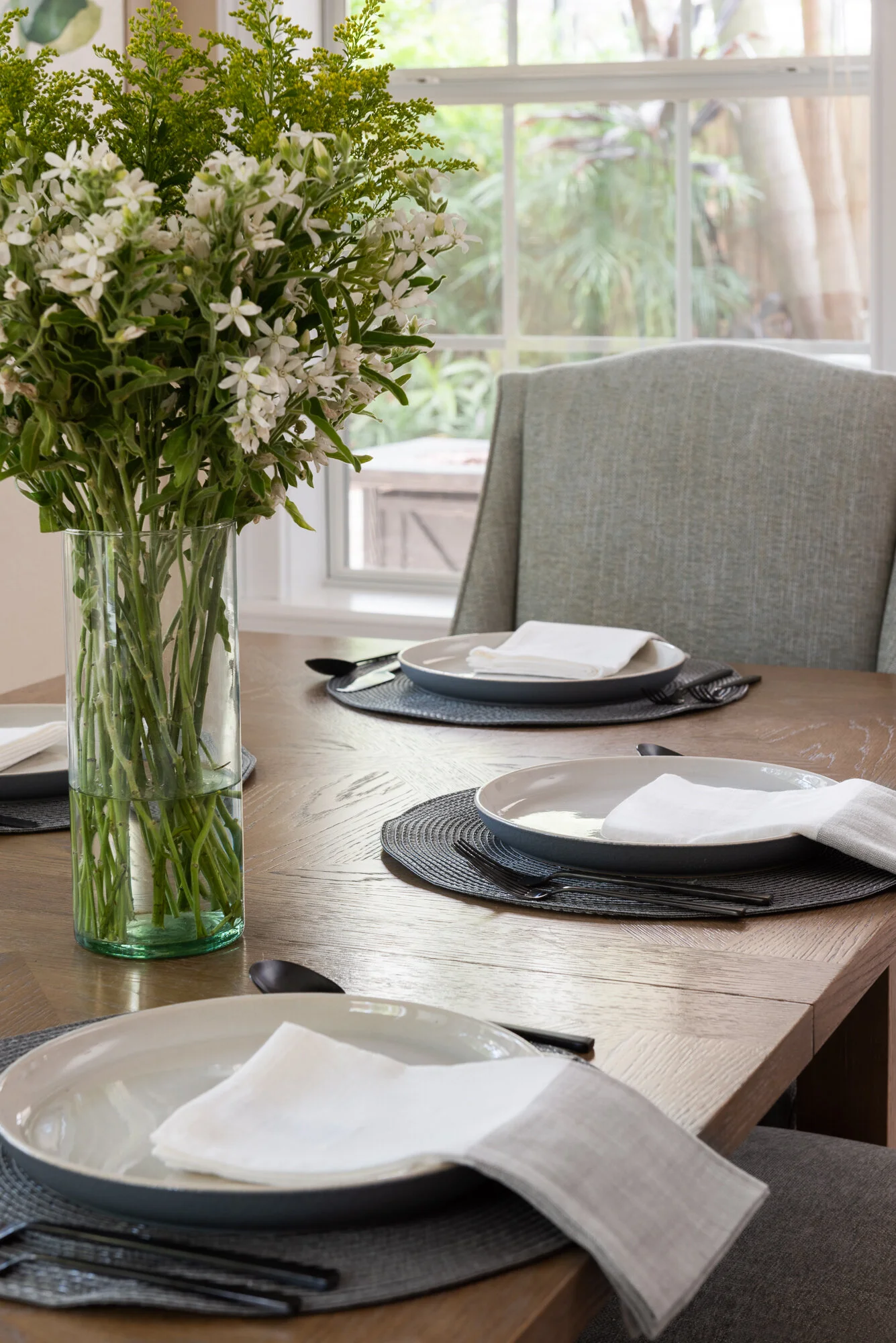 Dining room table setting with flower center piece and 