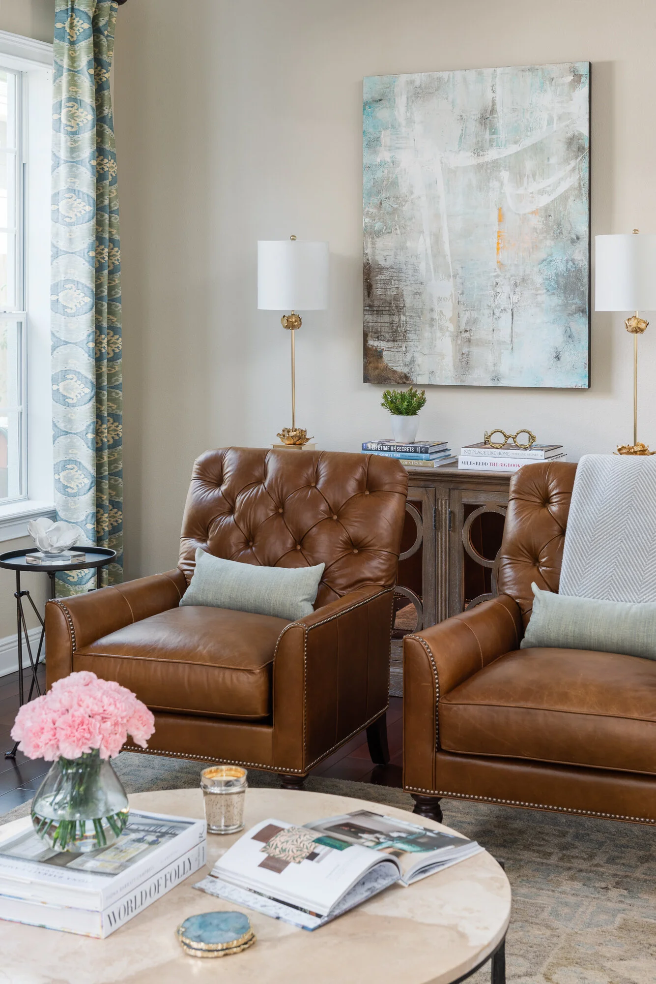 Traditional warm living room with leather armchairs