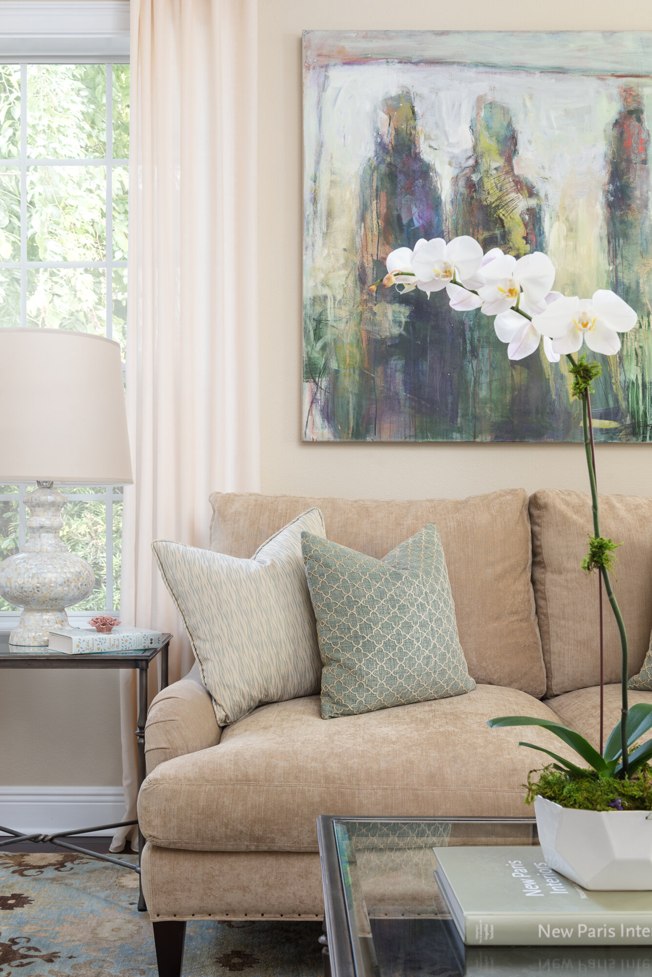 Traditional warm living room with flowers and pillows