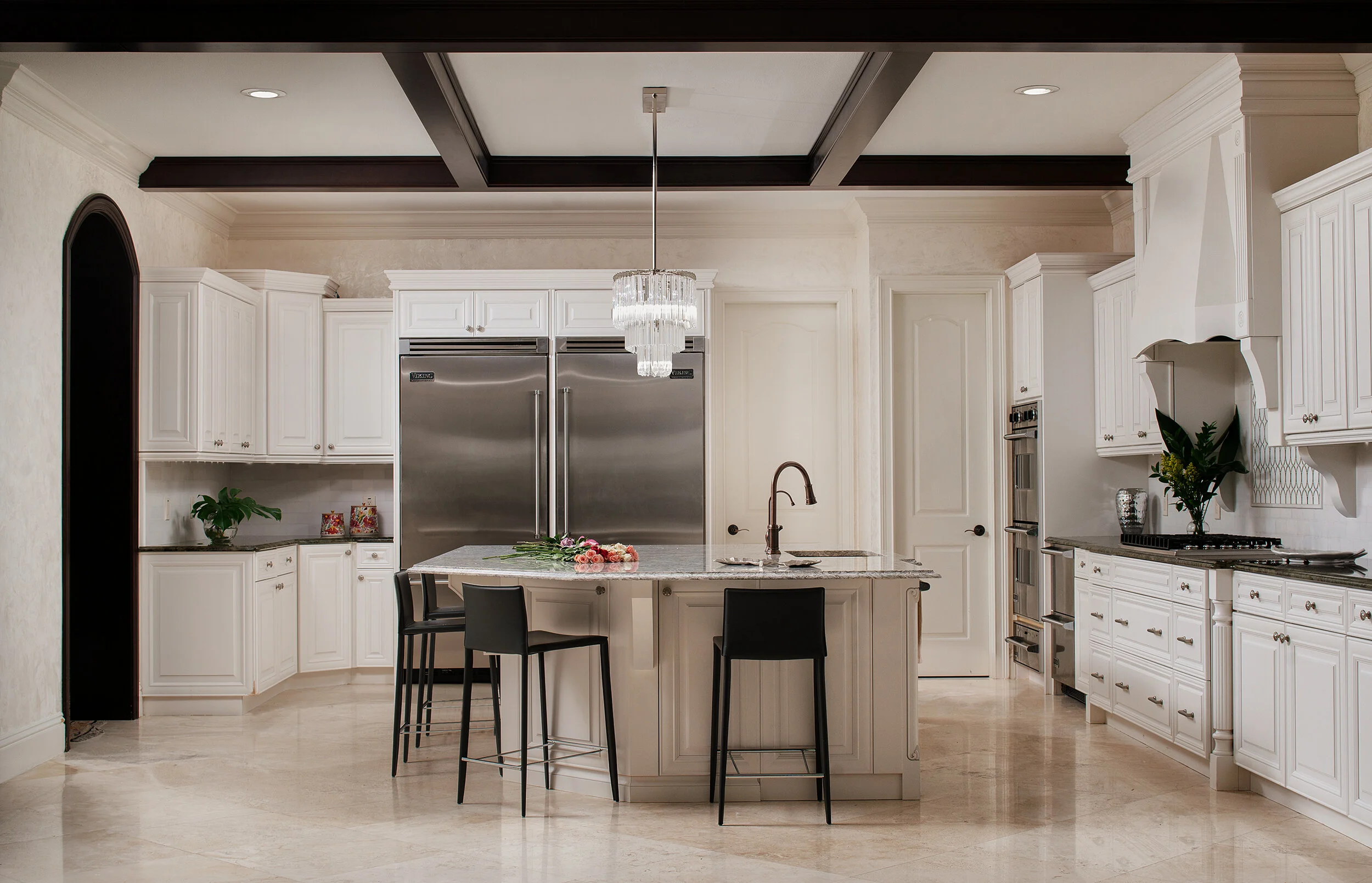 Big white classic modern kitchen with crystal chandelier wood trimming