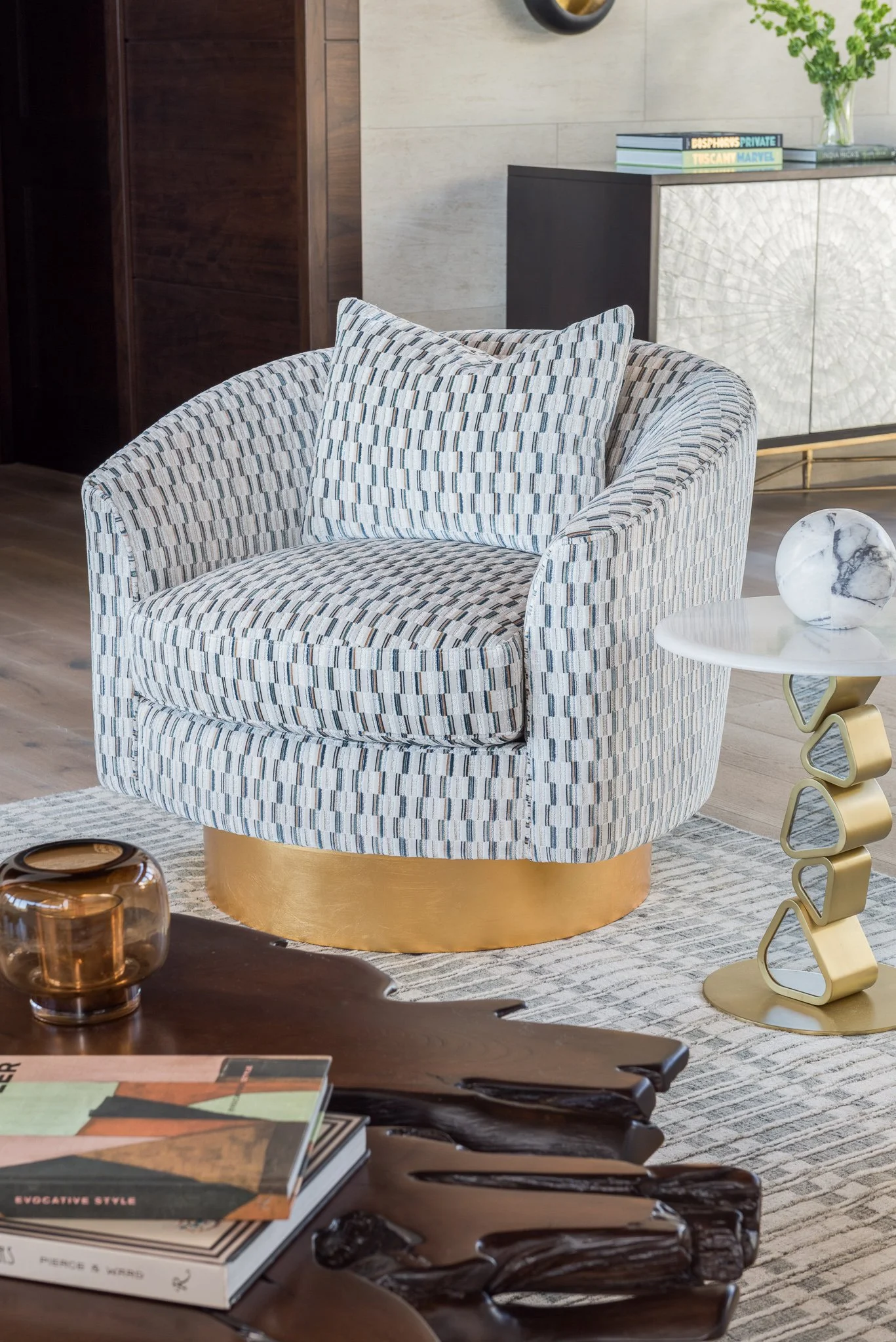  Graphic patterned swivel chair on a brass base 