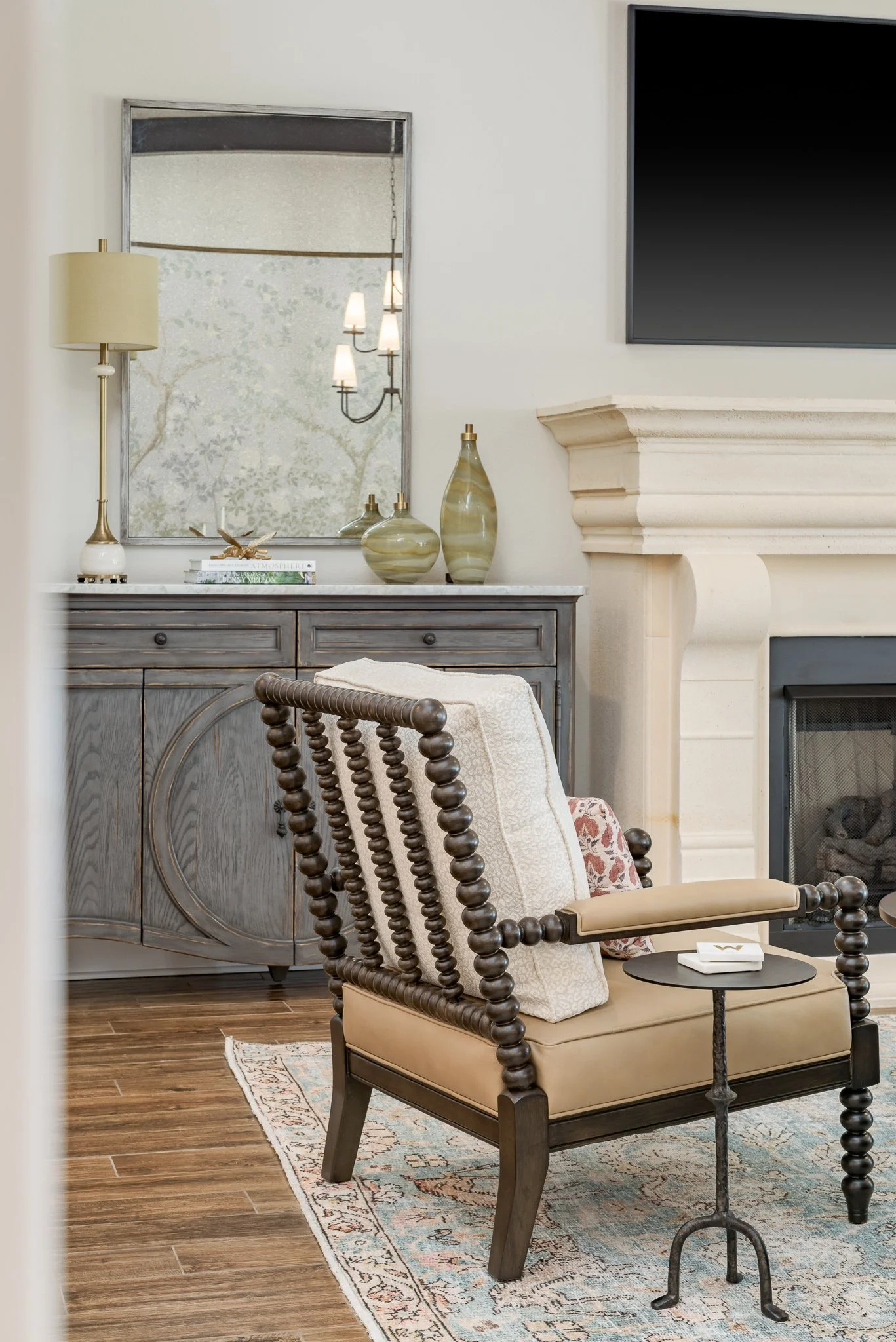  Cream spindle chair beside a fireplace 