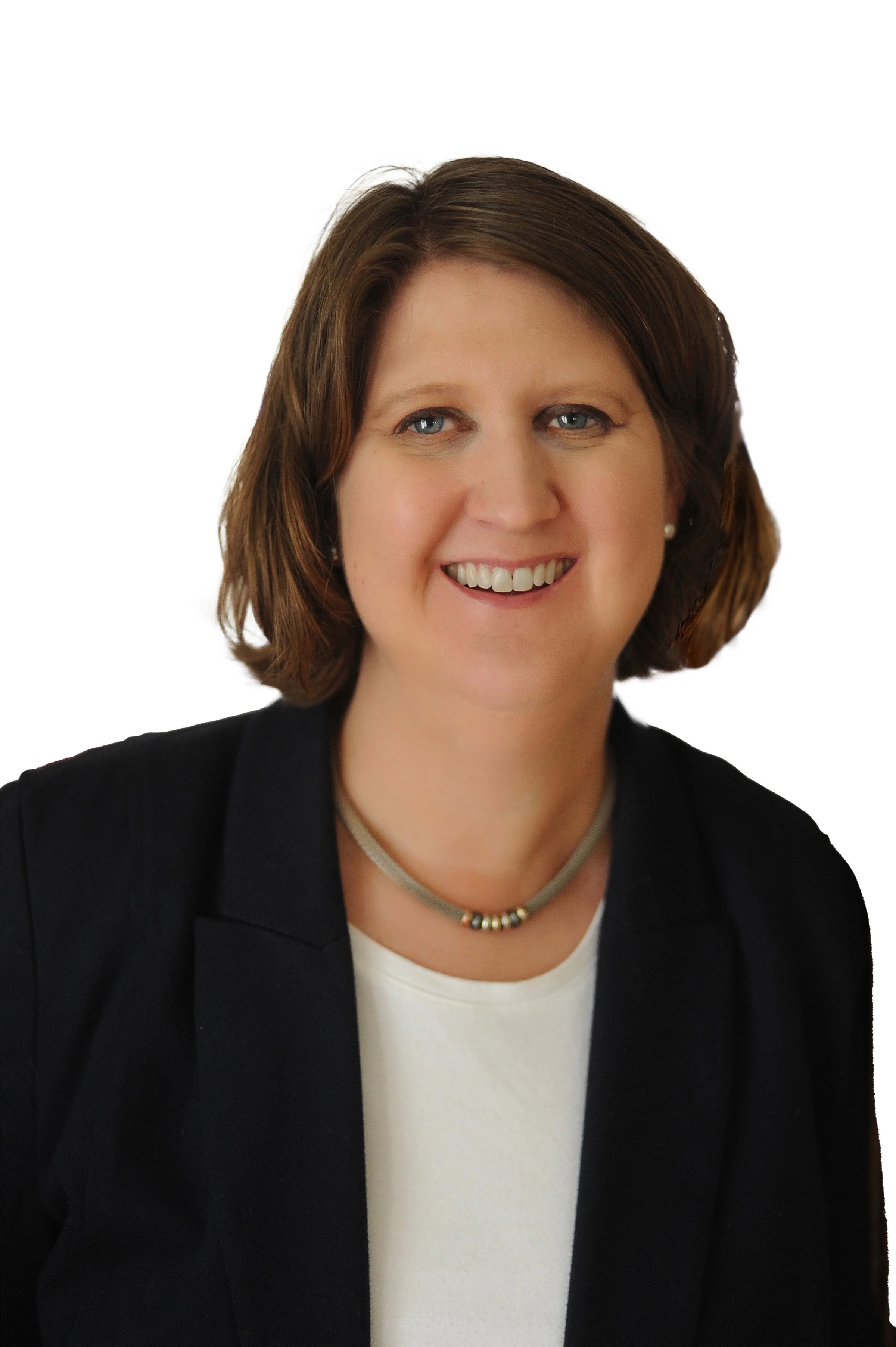 A woman with shoulder-length brown hair, smiling, wearing a black blazer, white top, and a beaded necklace, against a white background.