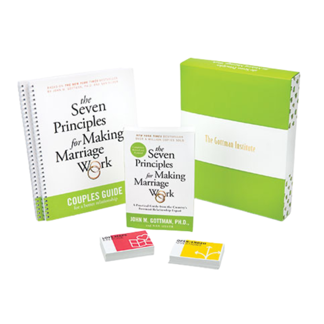 Set of books and materials on marriage counseling, including titles 'The Seven Principles for Making Marriage Work' and 'The Golden Institute,' with some decks of cards.