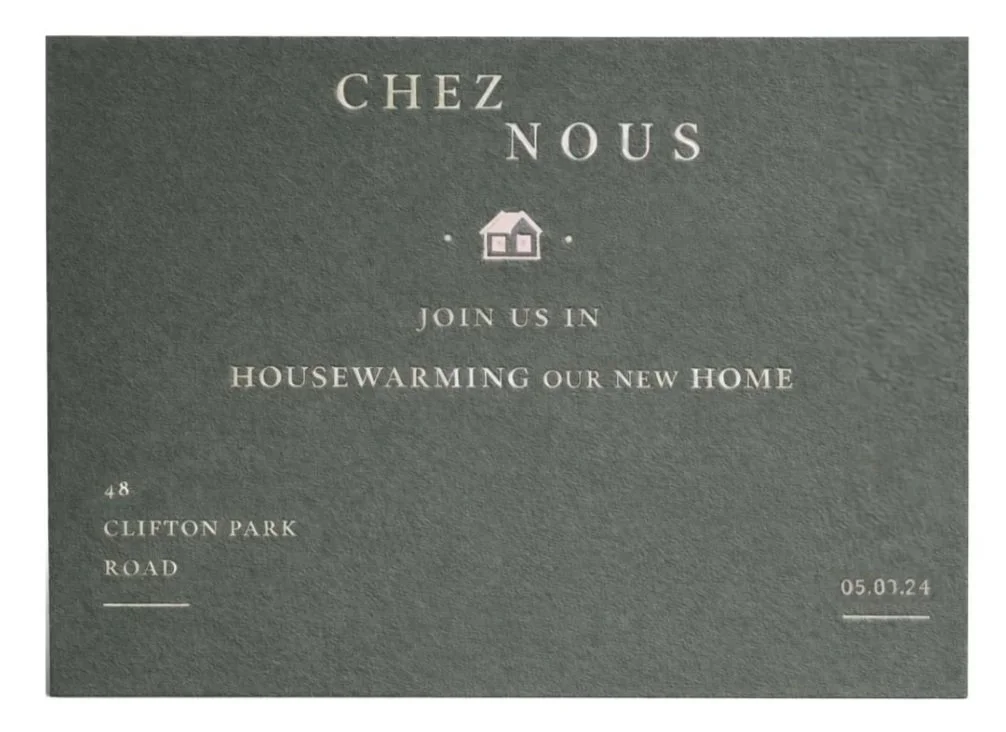 Custom hand-illustrated housewarming invitation with dark gray background, white text, and central house icon. Luxury bespoke stationery for a housewarming in North London.