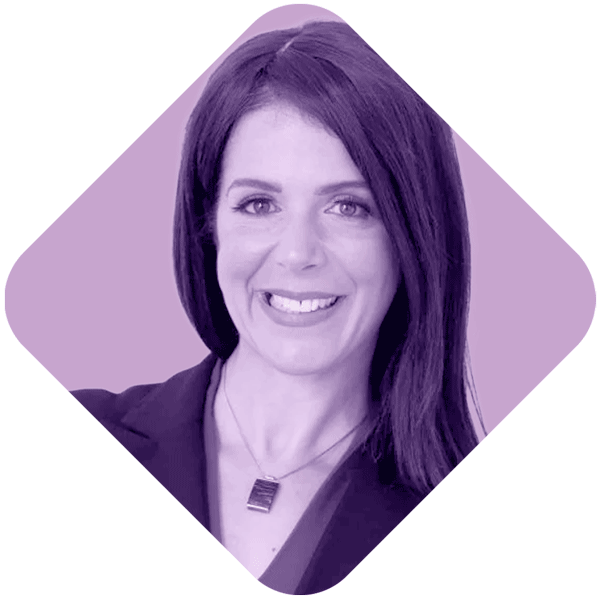 A woman with shoulder-length dark purple hair smiling against a light purple background.