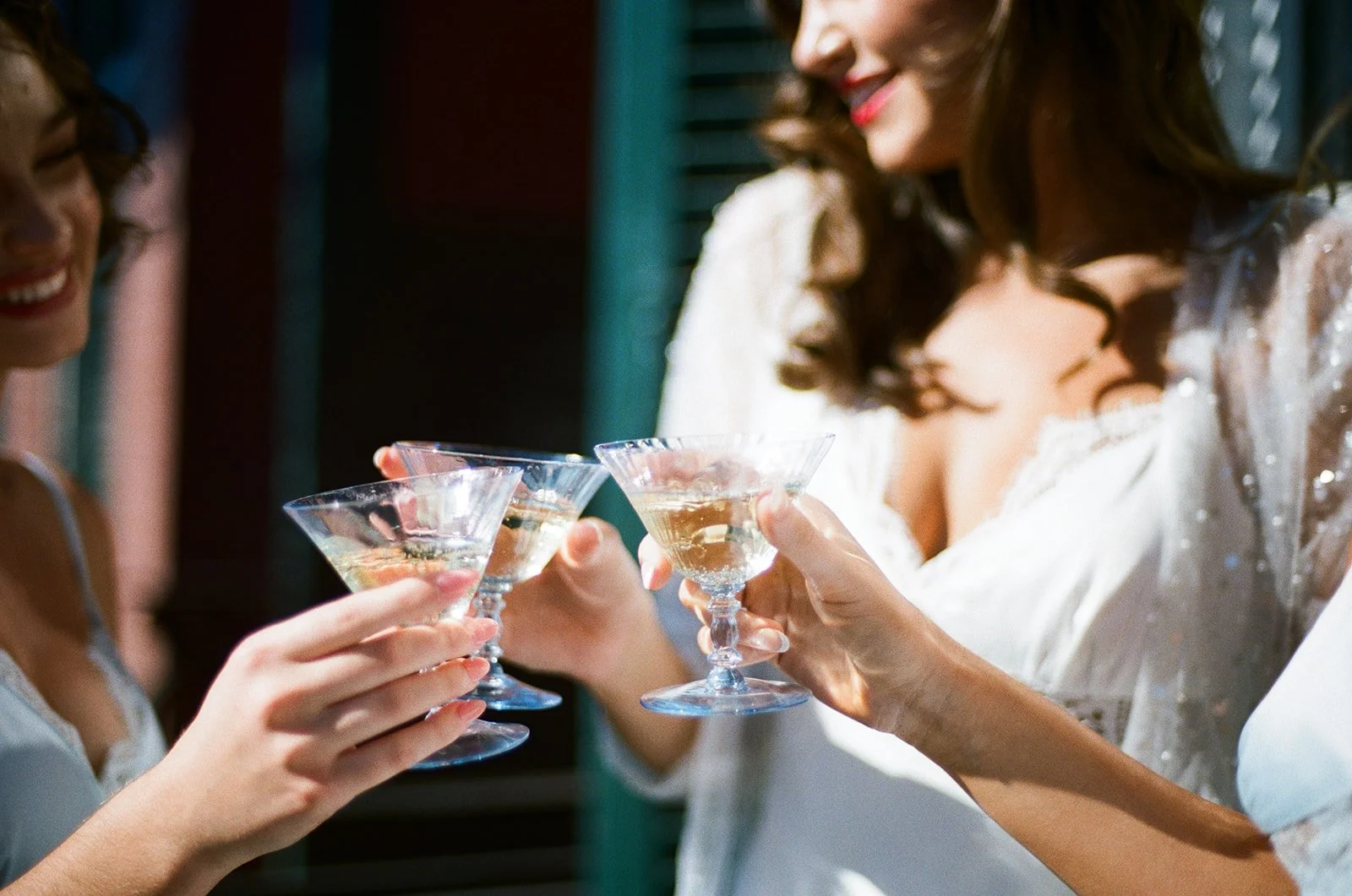 Women celebrating with champagne cocktails at a party.